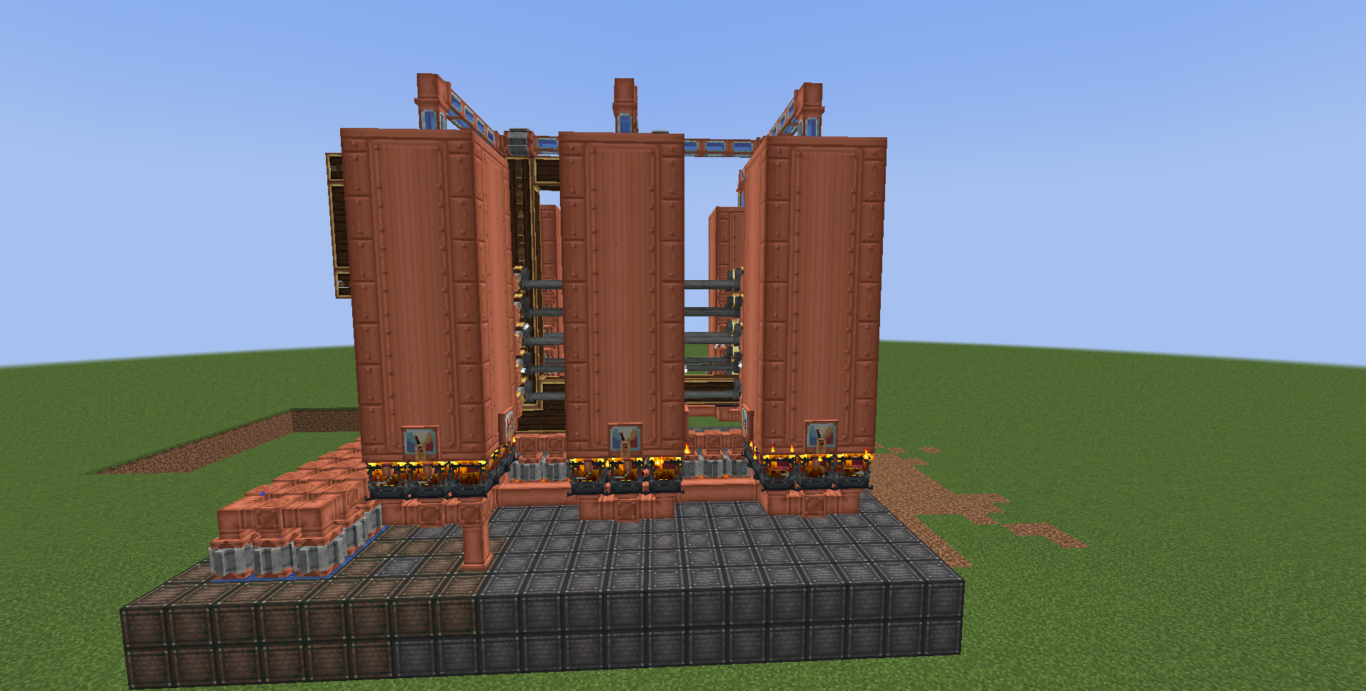 Side view of a large industrial copper machine with multiple vertical storage tanks