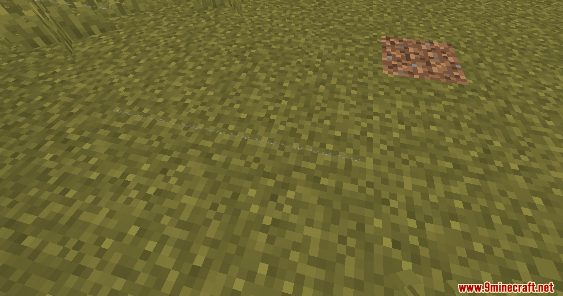 A single piece of string lying on the grass in Minecraft