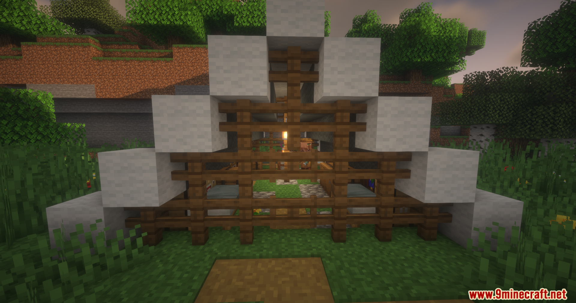 Small white wool tent structure with dark oak fences and a villager