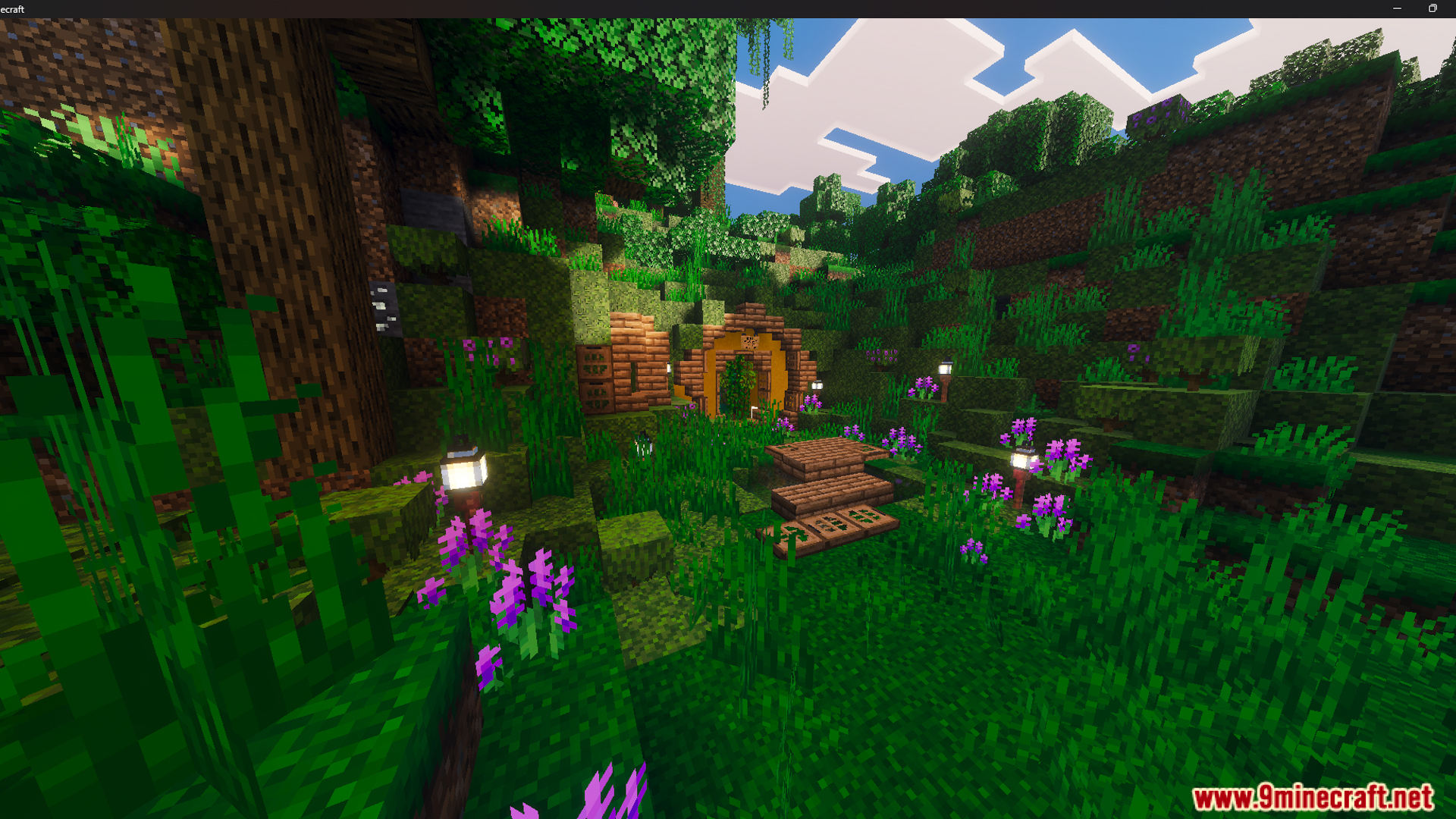 Outdoor space featuring a garden pond crossed by a small wooden bridge