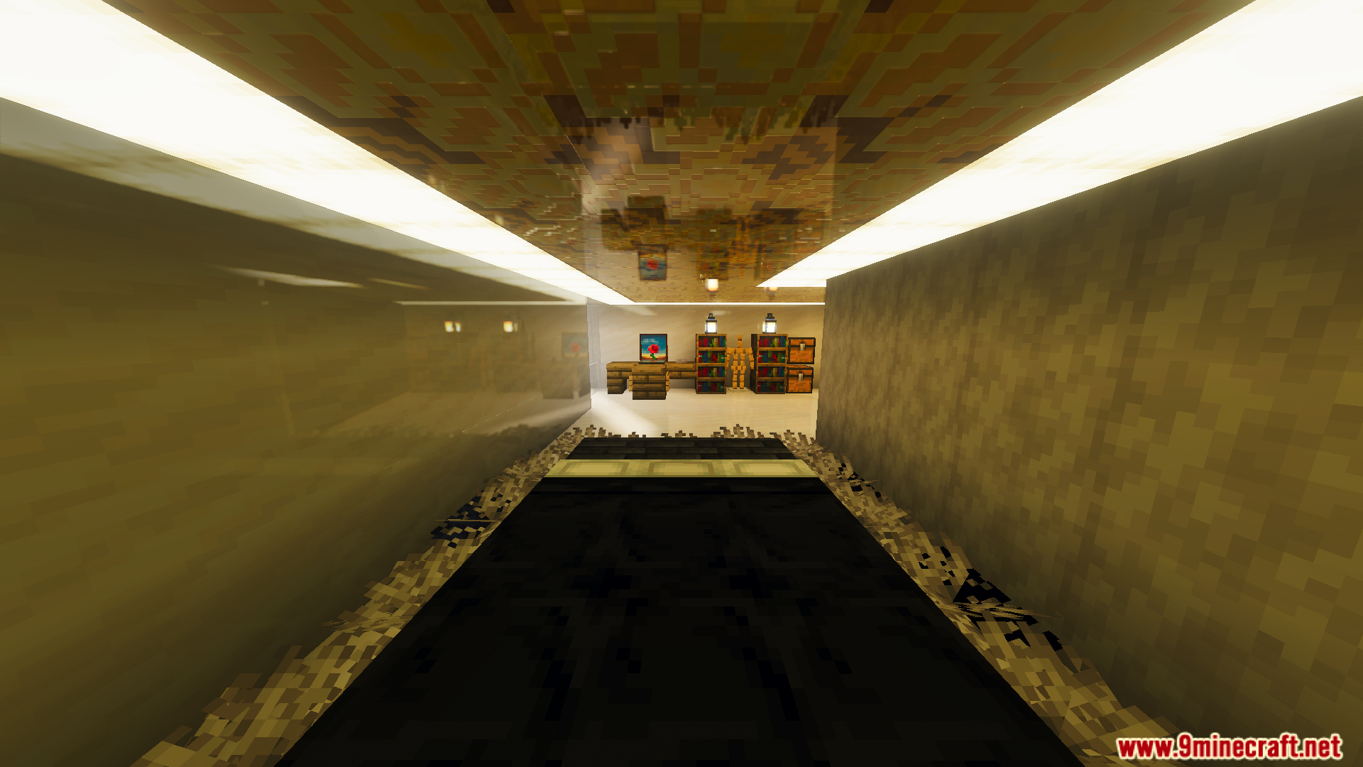 A narrow hallway with reflective surfaces leading to a room with survival furniture