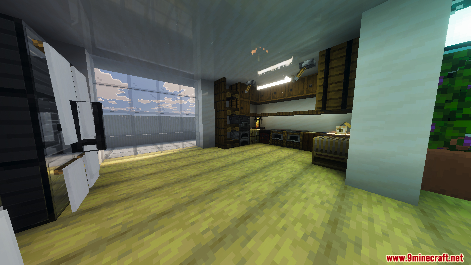 Fully decorated modern kitchen interior with wooden cabinets and large glass windows