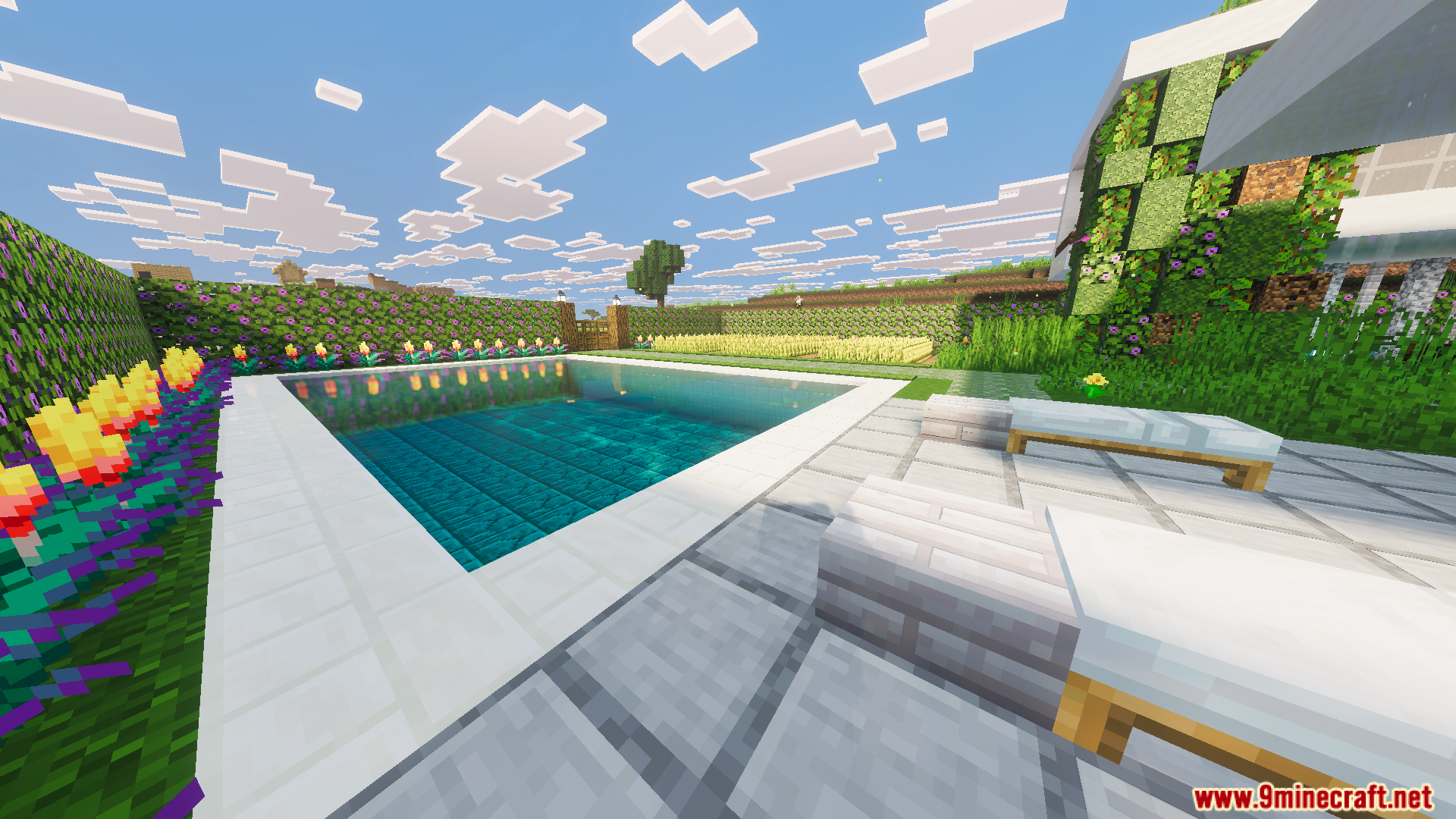Large swimming pool and lounge chairs in the garden of a modern villa