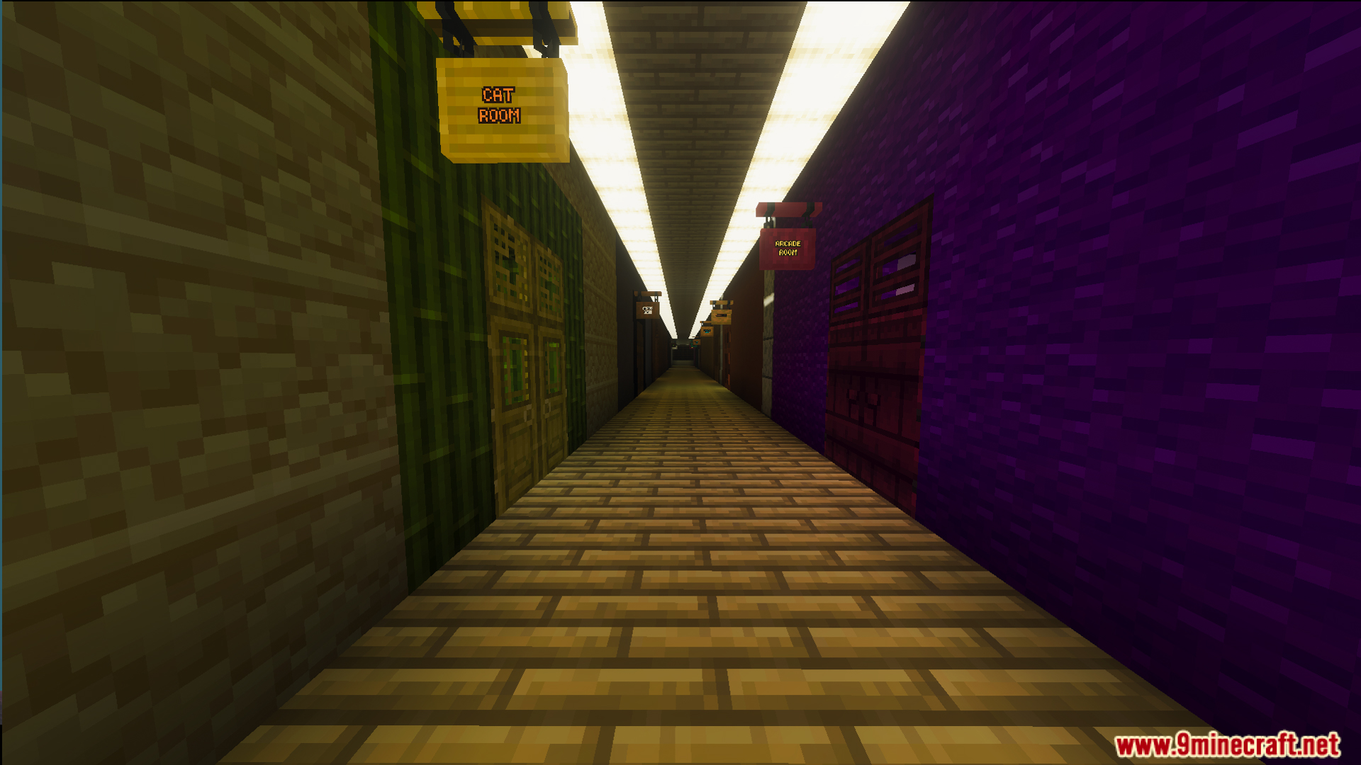 A long hallway with wooden floors and signs for rooms inside the mansion