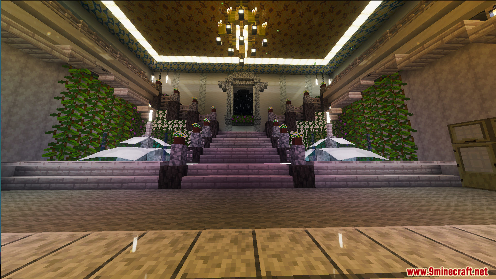 Grand staircase and chandelier inside a fully decorated mansion with indoor fountains