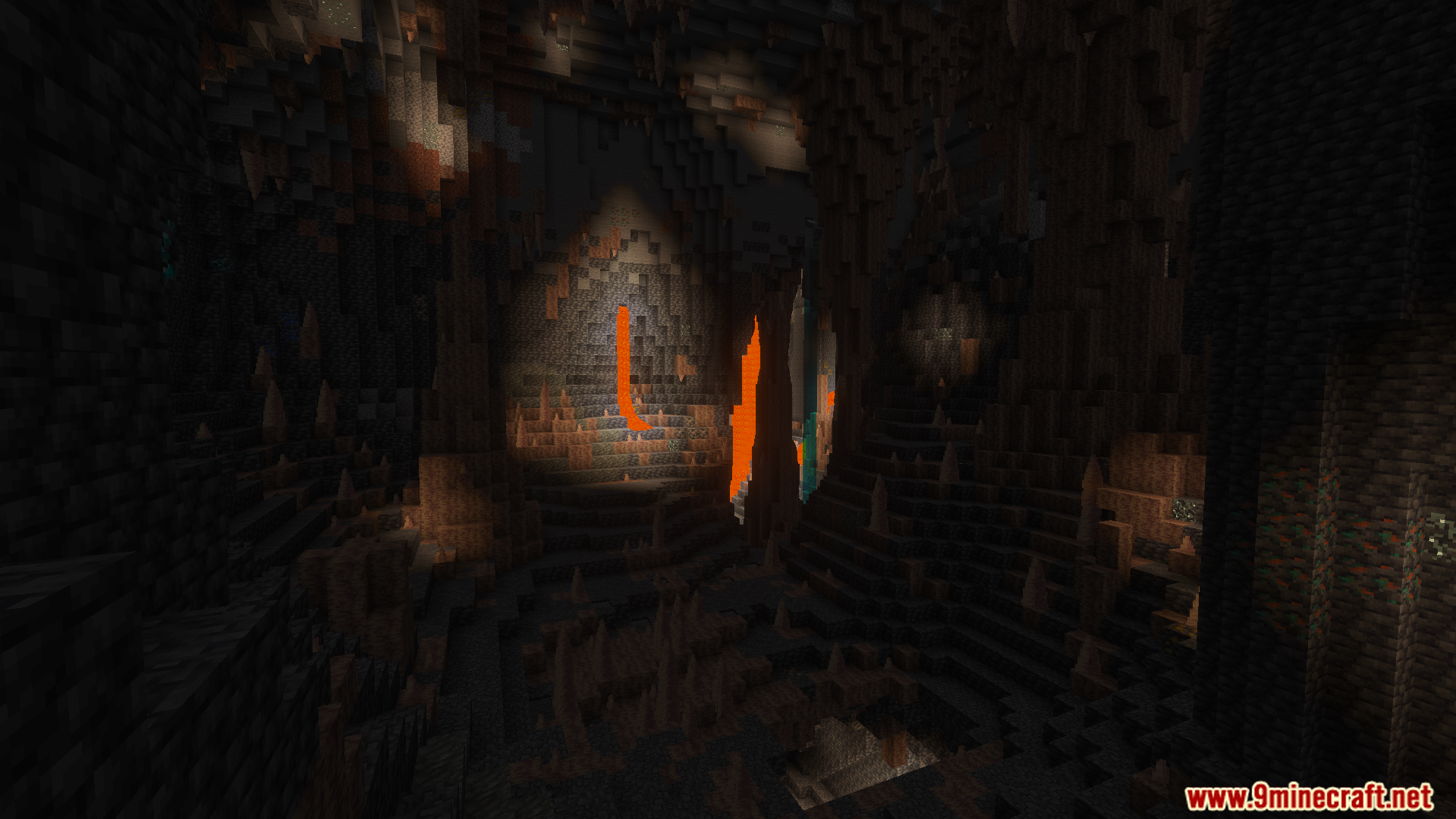 A dark underground cave with lava falls and pointed dripstone before night vision