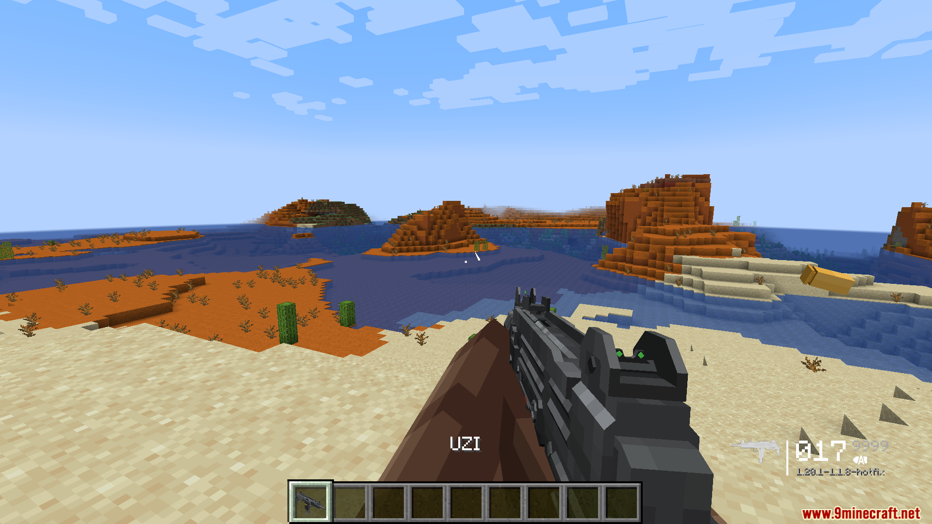 TACZ Endless Ammo Mod Screenshot 10 A player holds an Uzi submachine gun while exploring a desert biome