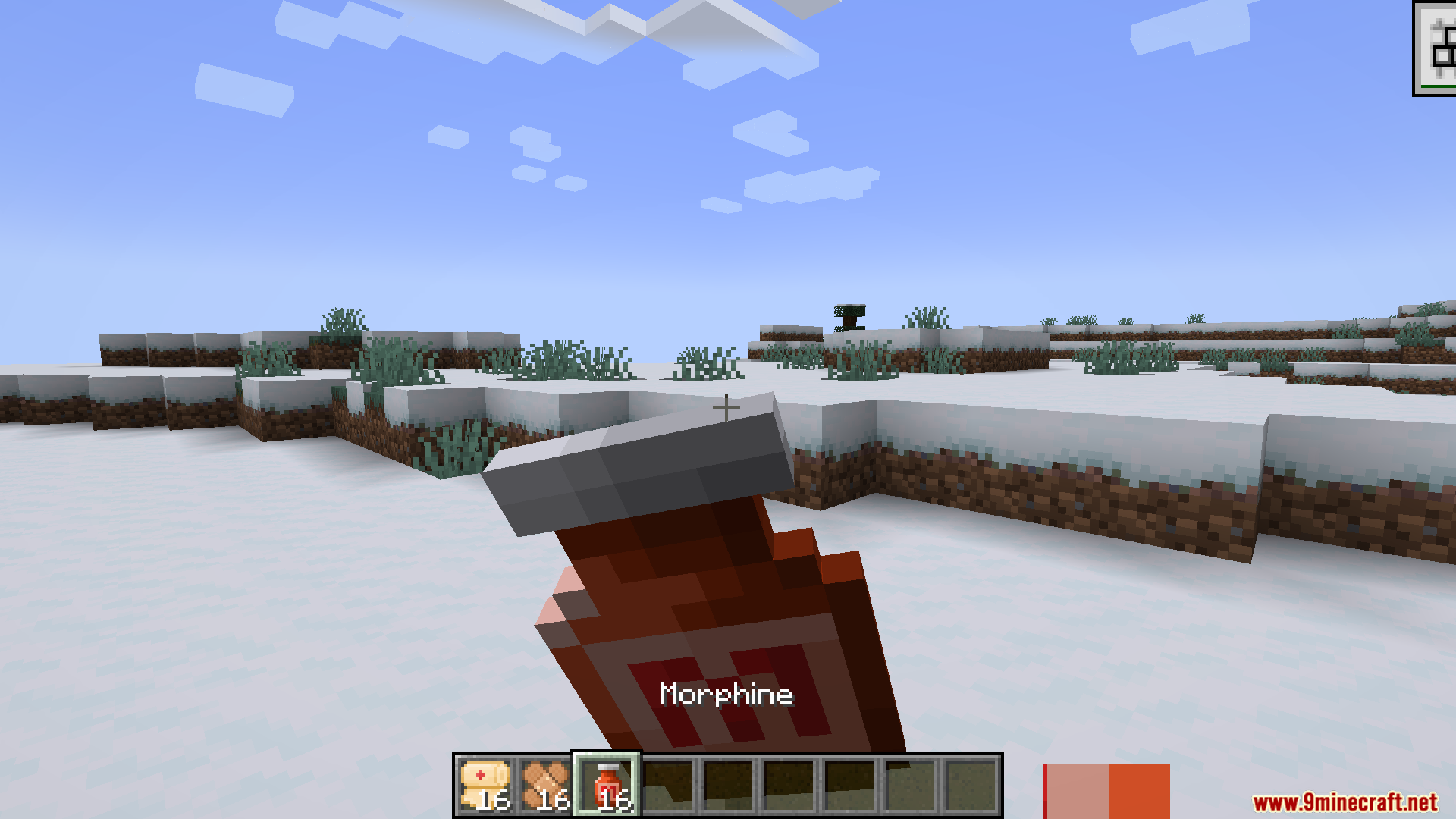 TACZ First Aid Compat Mod Screenshot 4 Player holding a bottle of morphine while standing in a snowy Minecraft landscape