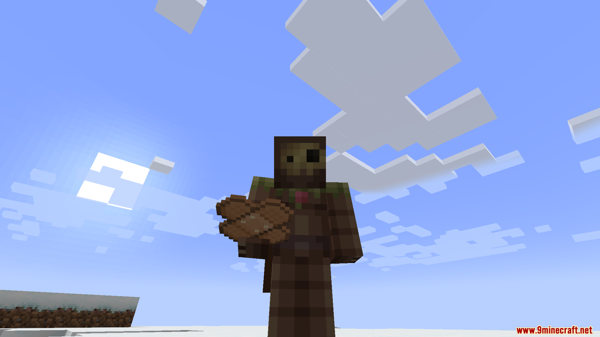 TACZ First Aid Compat Mod Screenshot 9 Minecraft character holding a stack of bandages in a snowy field
