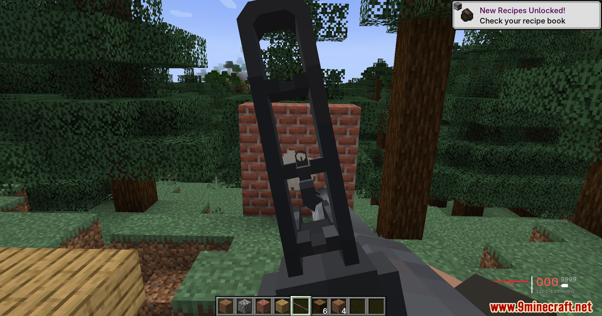 A player aims a gun through a tall sight at a brick wall