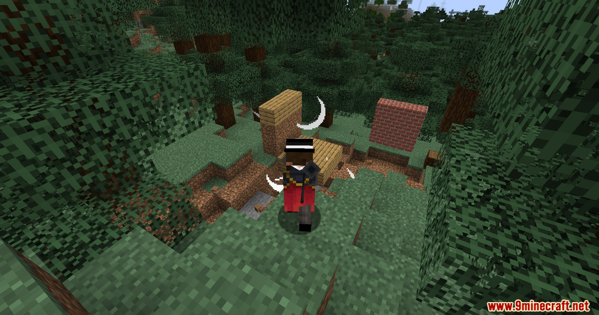 Player character in a forest using a tool to rotate heavy building blocks