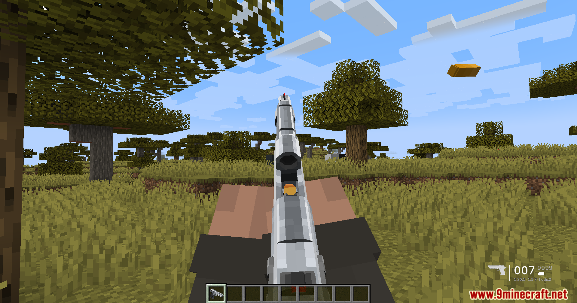 TaCZ Optimization Mod Screenshot 5 A player fires a silver pistol in a savanna biome with a flying casing