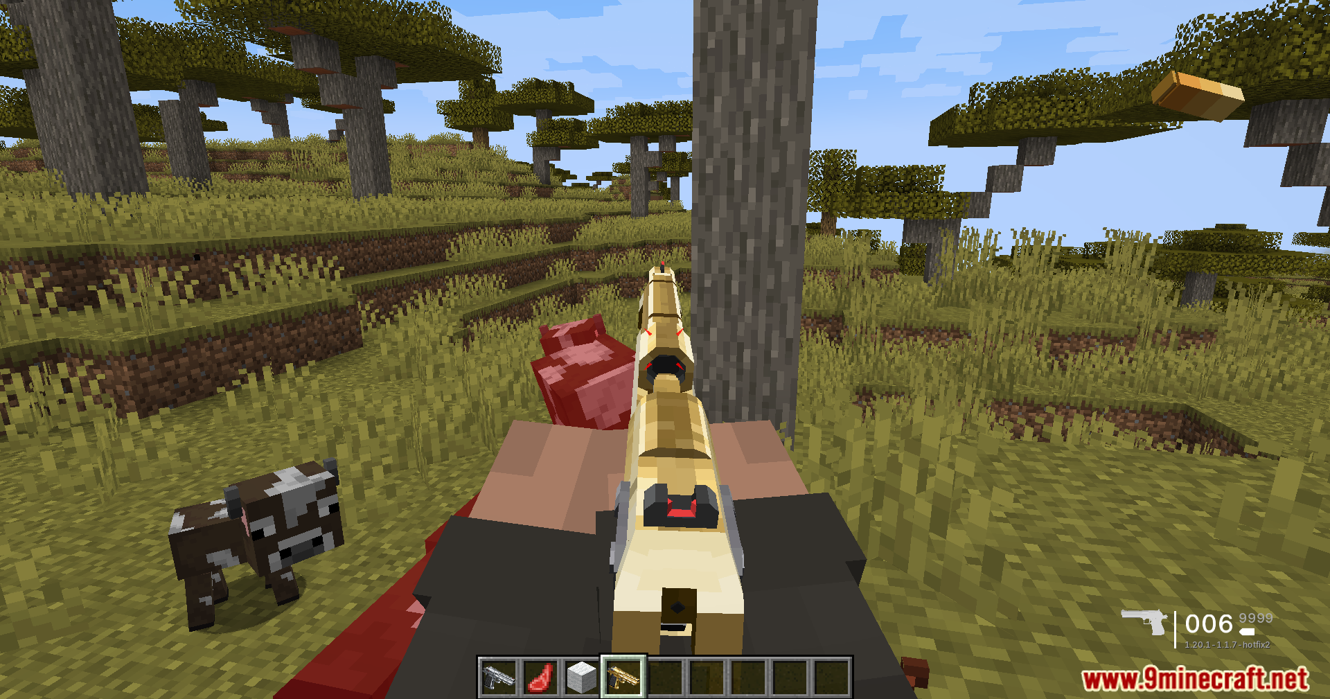 TaCZ Optimization Mod Screenshot 9 Player holding a tan rifle in a savanna biome with a cow nearby