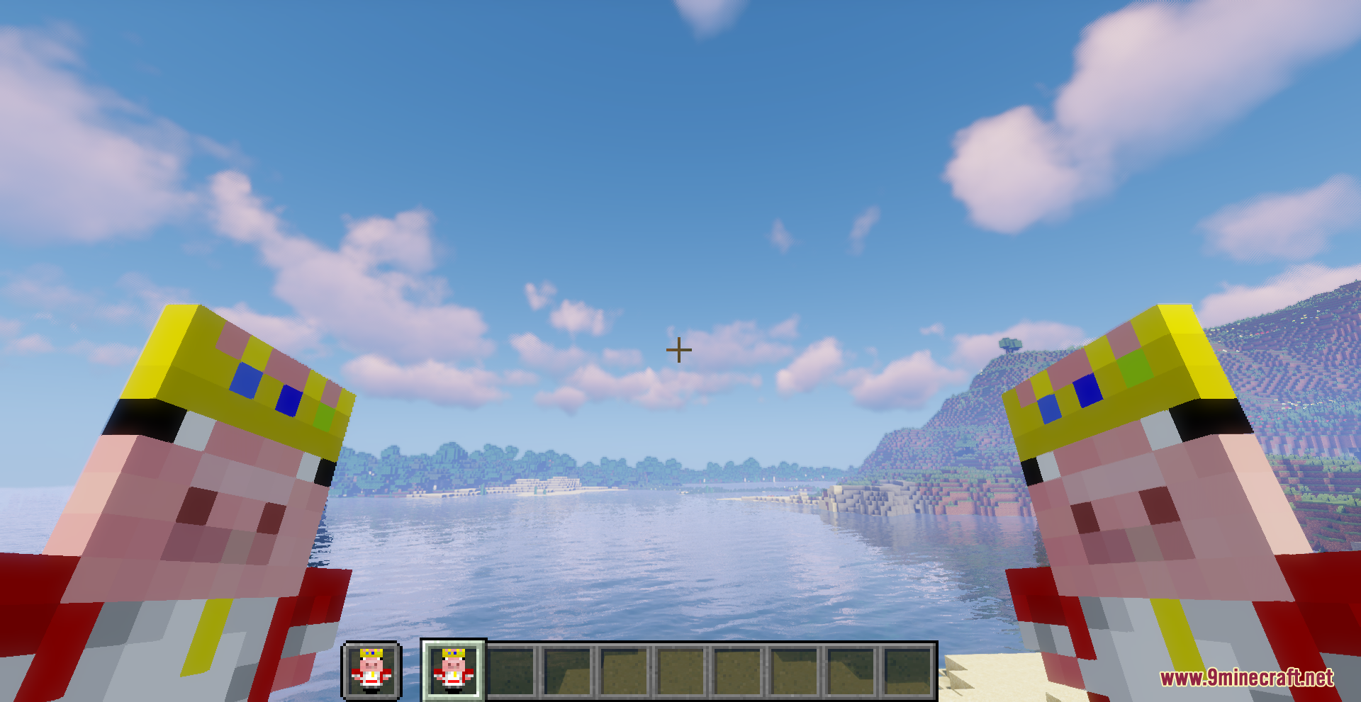 A player holding two Technoblade Totems of Undying in a scenic landscape