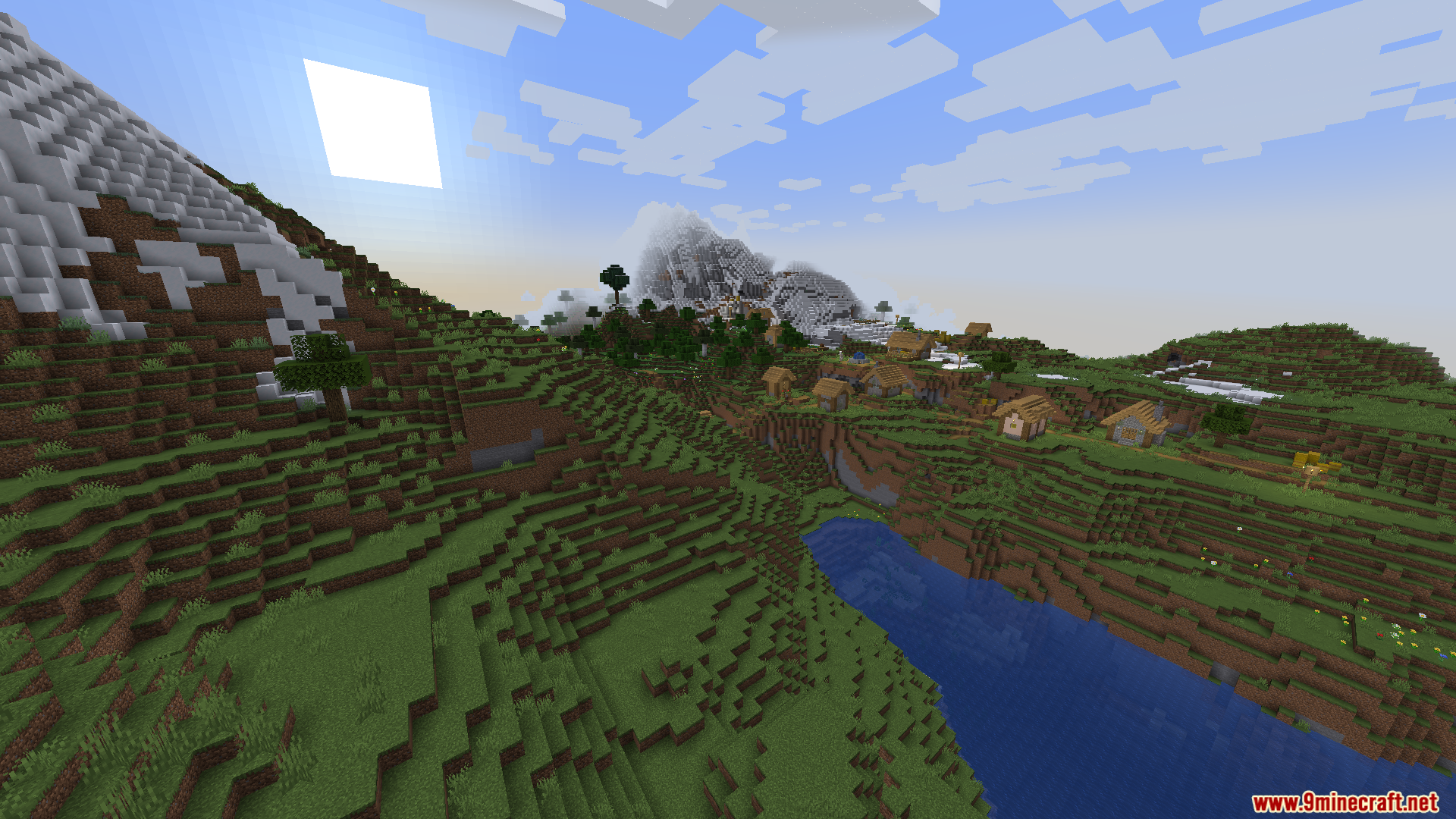 Thaumon PT BR Translation Resource Pack Screenshot 3 A scenic Minecraft landscape featuring a village nestled between mountains and a river