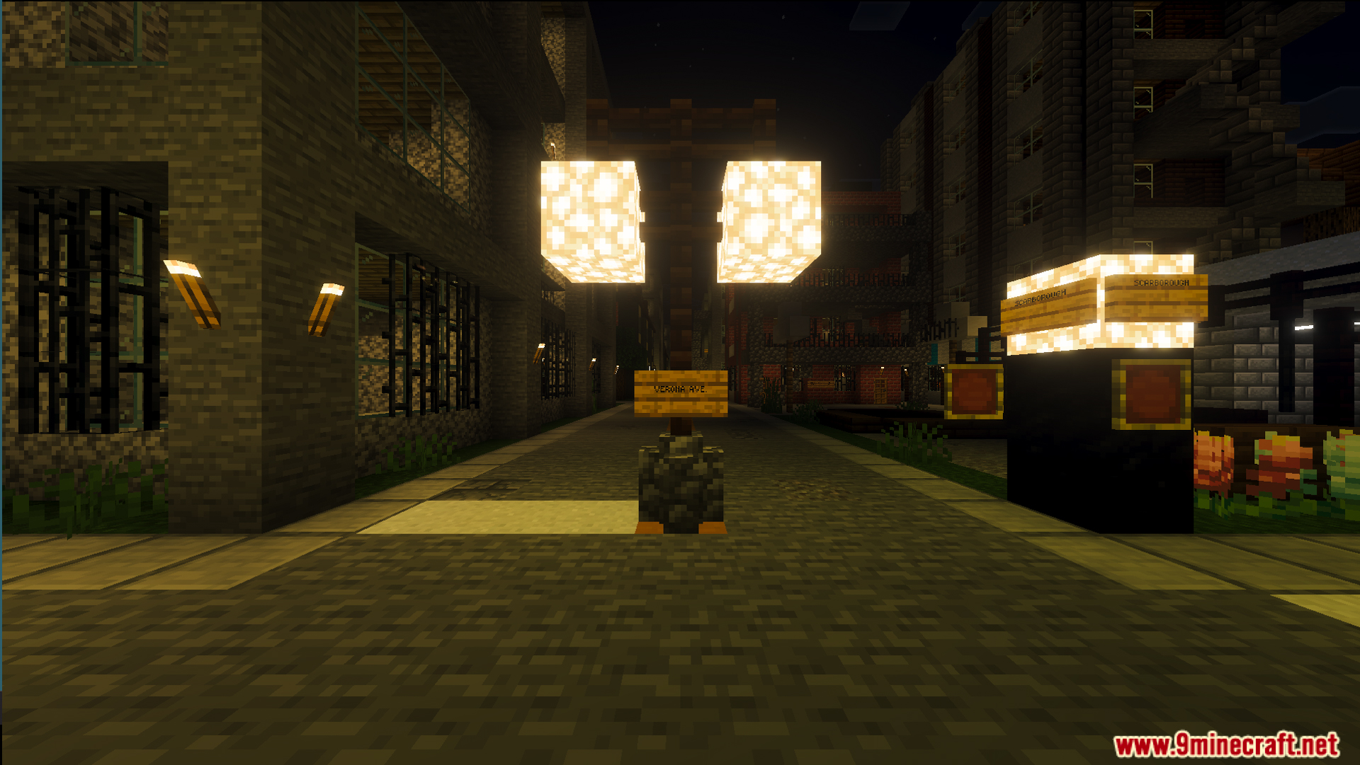 Empty sidewalks and identical apartment buildings under glowing streetlights in a silent city