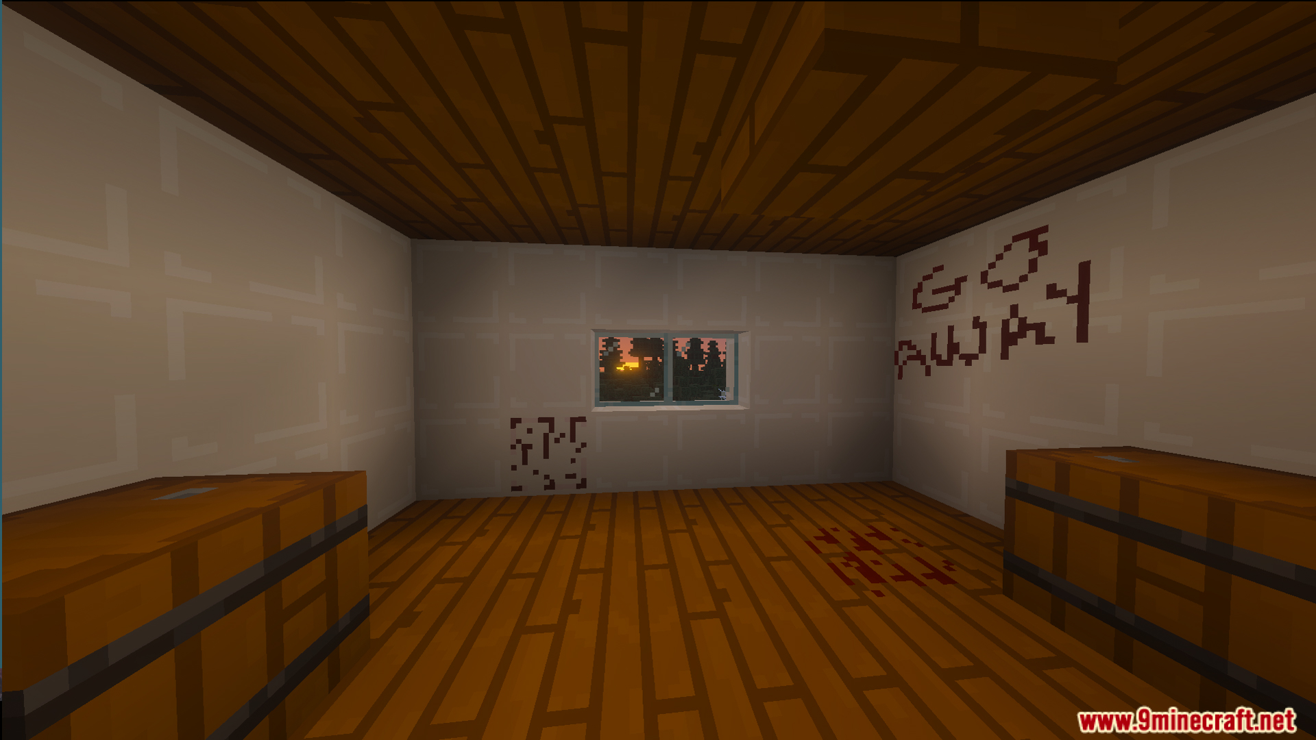 A scary room with blood stains and go away written on the wall