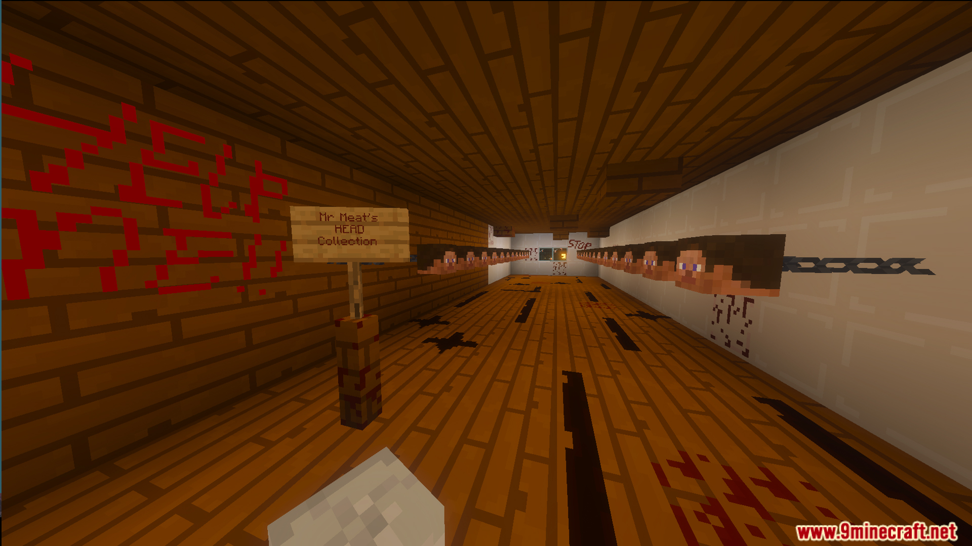 Hallway in Mr Meat scary house with a sign and head collection