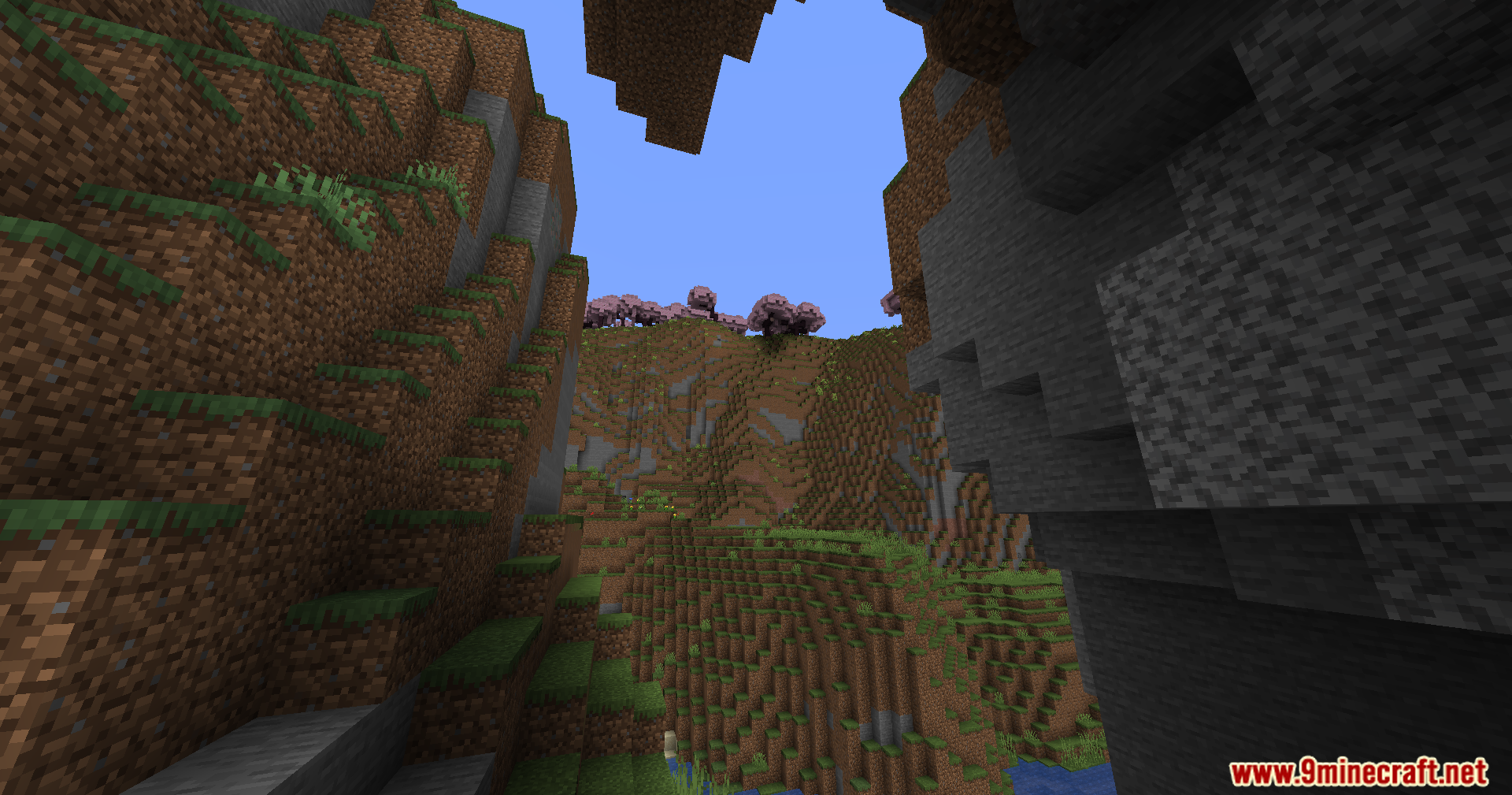 The Nofog Mod Screenshot 8 A clear view of cherry blossom trees on a mountain under a blue sky