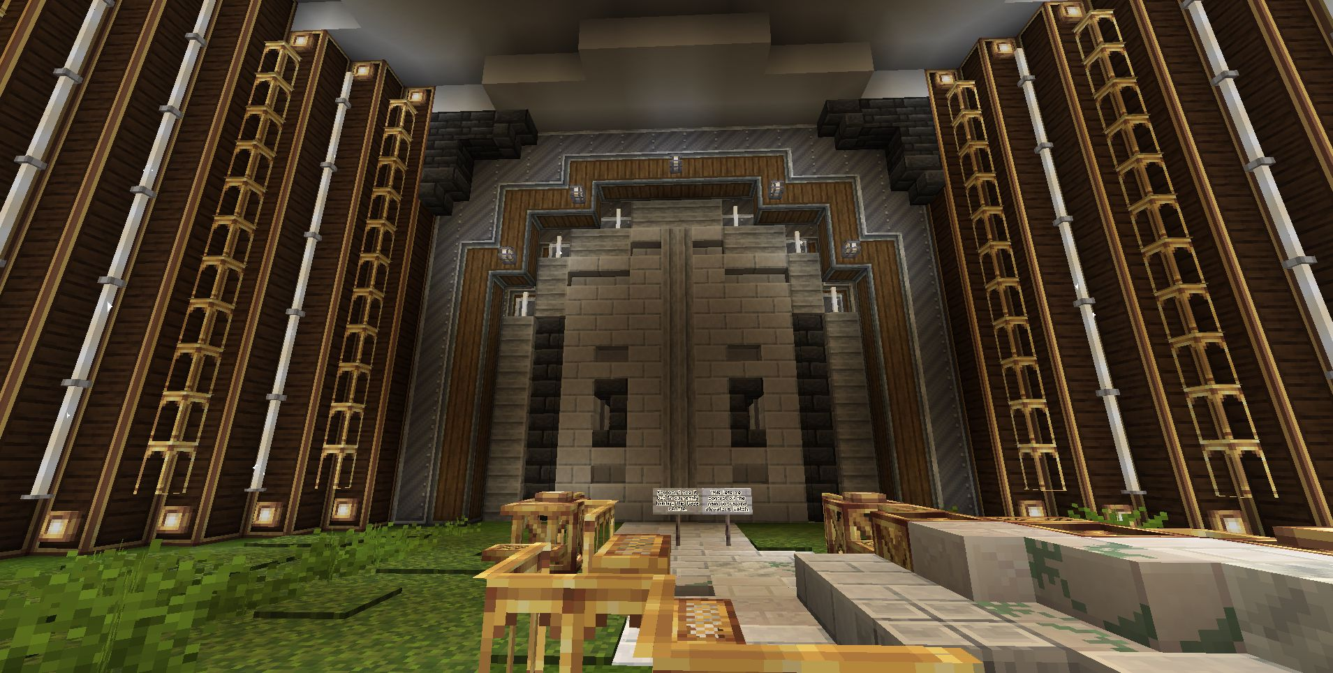 Grand interior of a massive factory building with decorative walls and stone doors