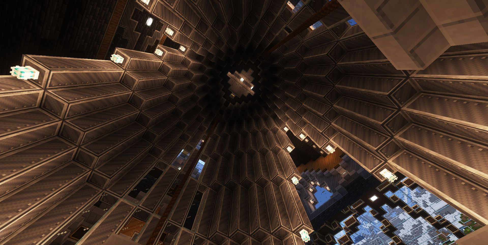 Looking up at a massive vaulted ceiling with geometric patterns and glowing lights