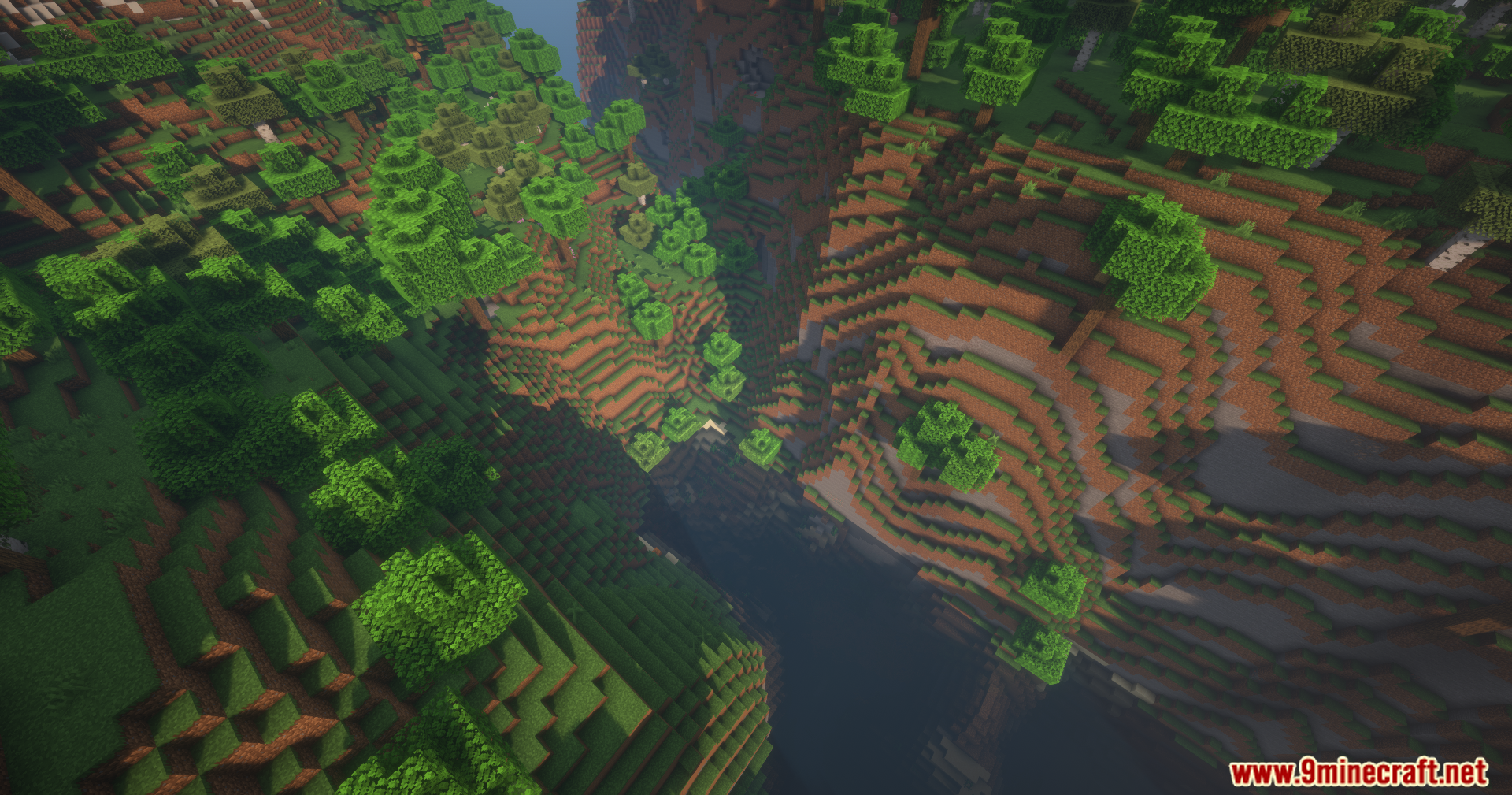 Thread Tweak Reforged Mod Screenshot 10 An aerial view of a deep canyon with a river in Minecraft