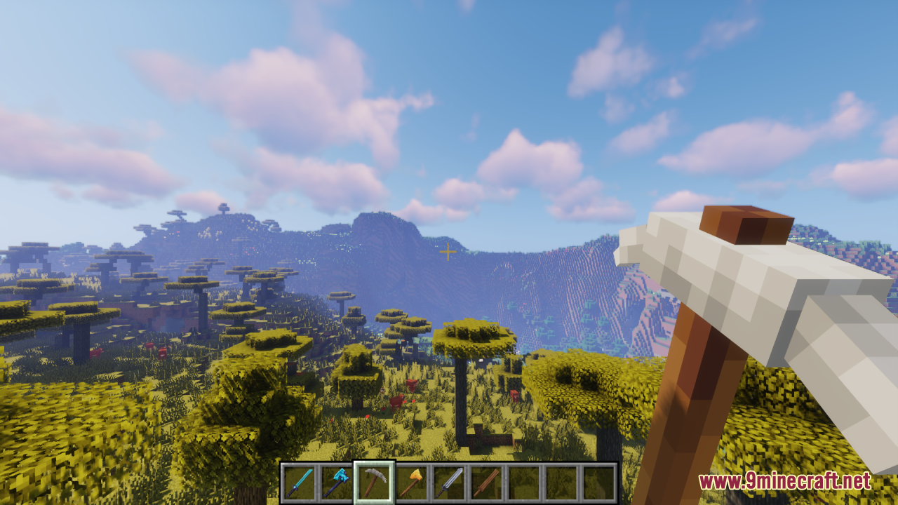 Tools 3D Resource Pack Screenshot 6 Player holding a thick 3D stone pickaxe while exploring a savanna biome