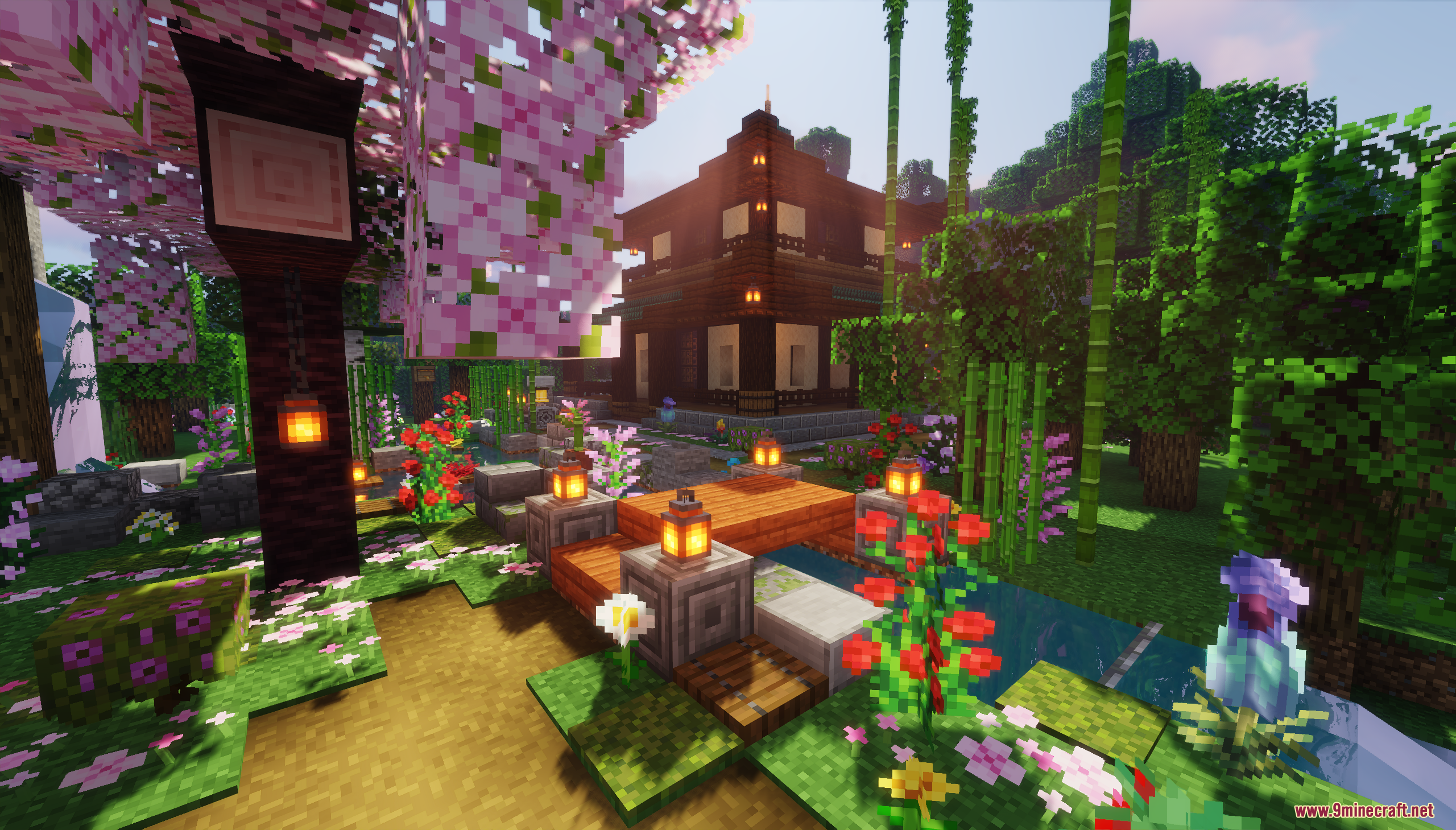 Pink cherry blossoms and lanterns decorate a garden path near a wooden house