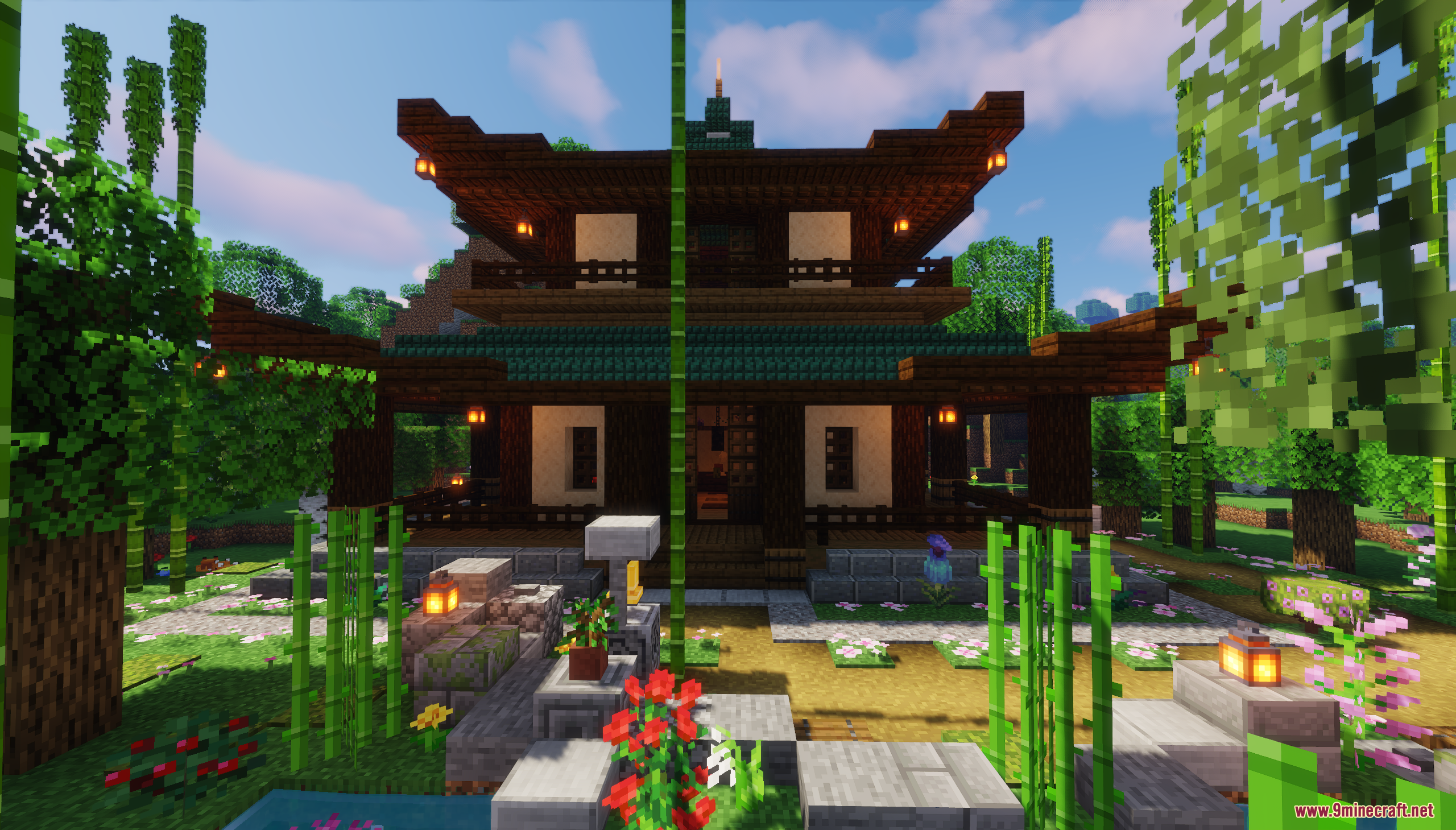 Front view of a two story Japanese house with lanterns and bamboo garden