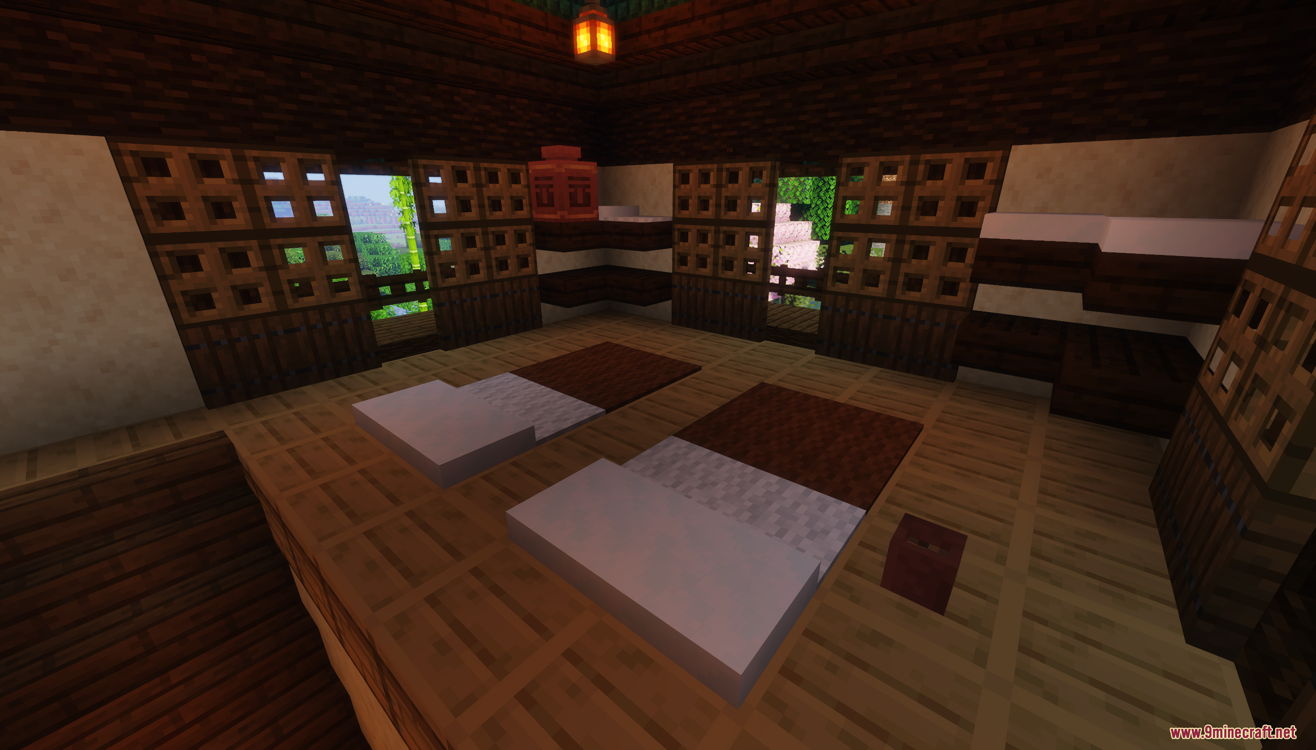 Interior of a Japanese style bedroom with wooden screens and two beds