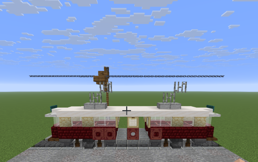 Tramway Schematic Screenshots 1 A red and white tramway car sitting on tracks under chain power lines