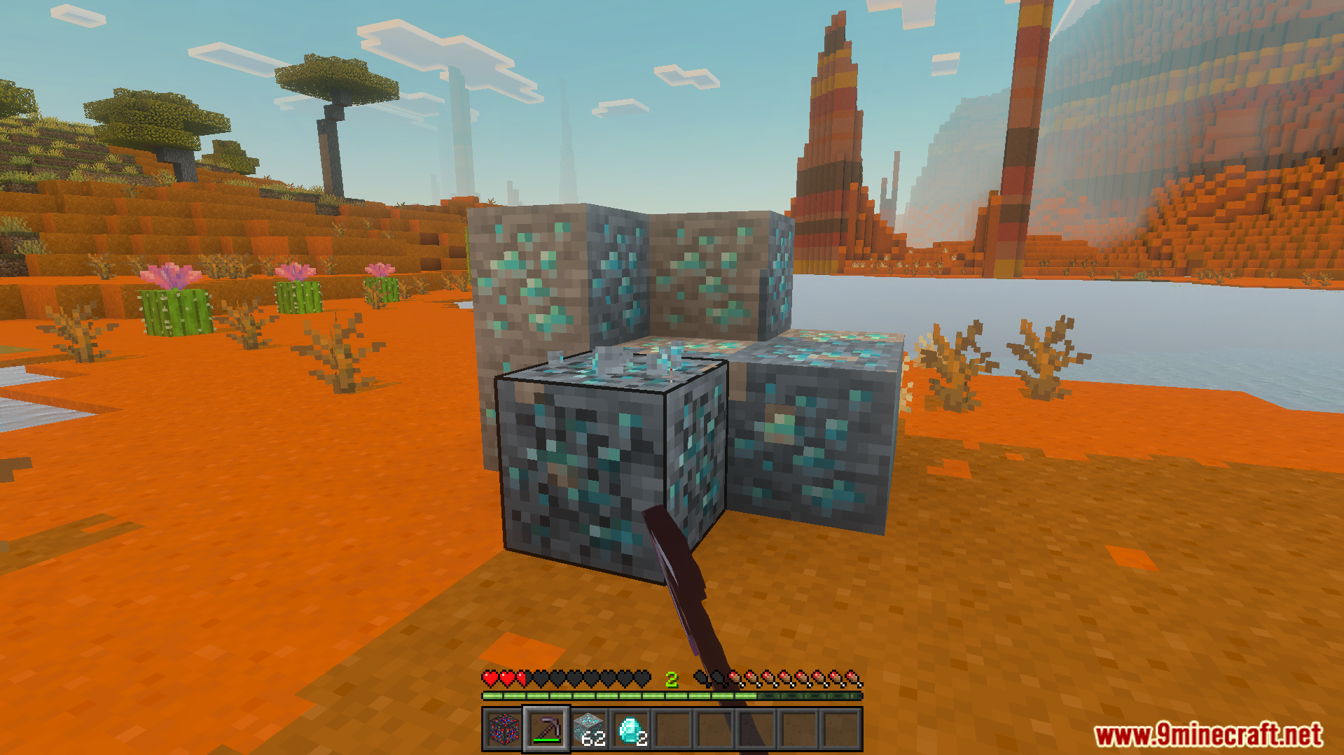 Player using a pickaxe to mine connected ore blocks with a single hit