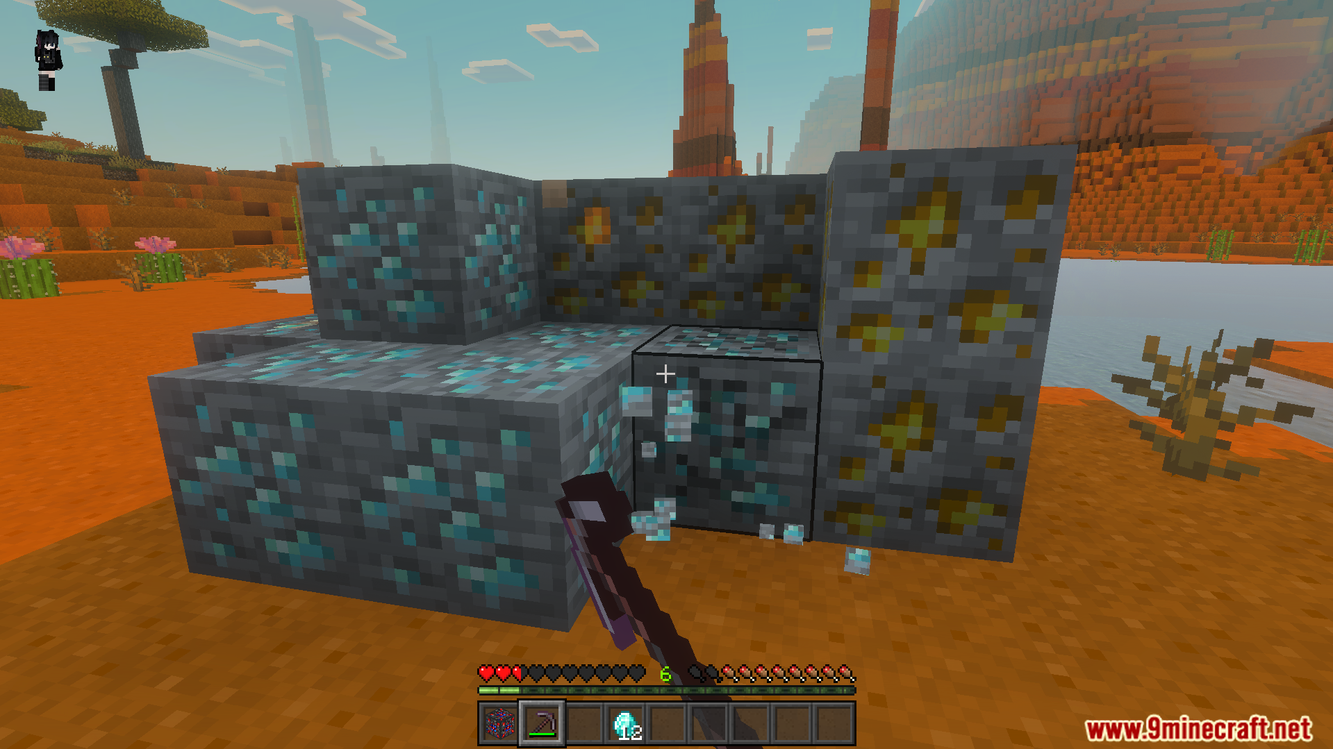 Player mining a large cluster of diamond and gold ores in mesa biome