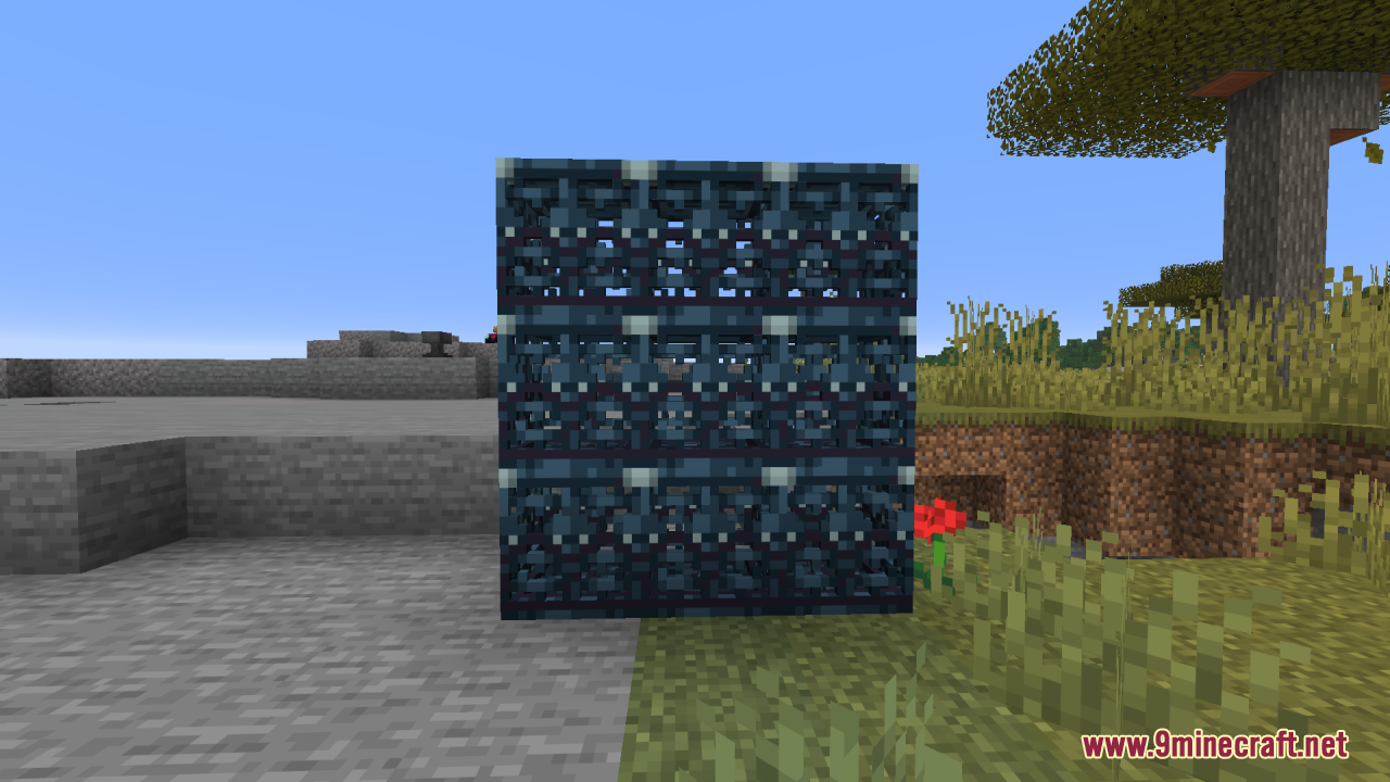 A large wall of nine 3D trial spawners standing in a grassy field