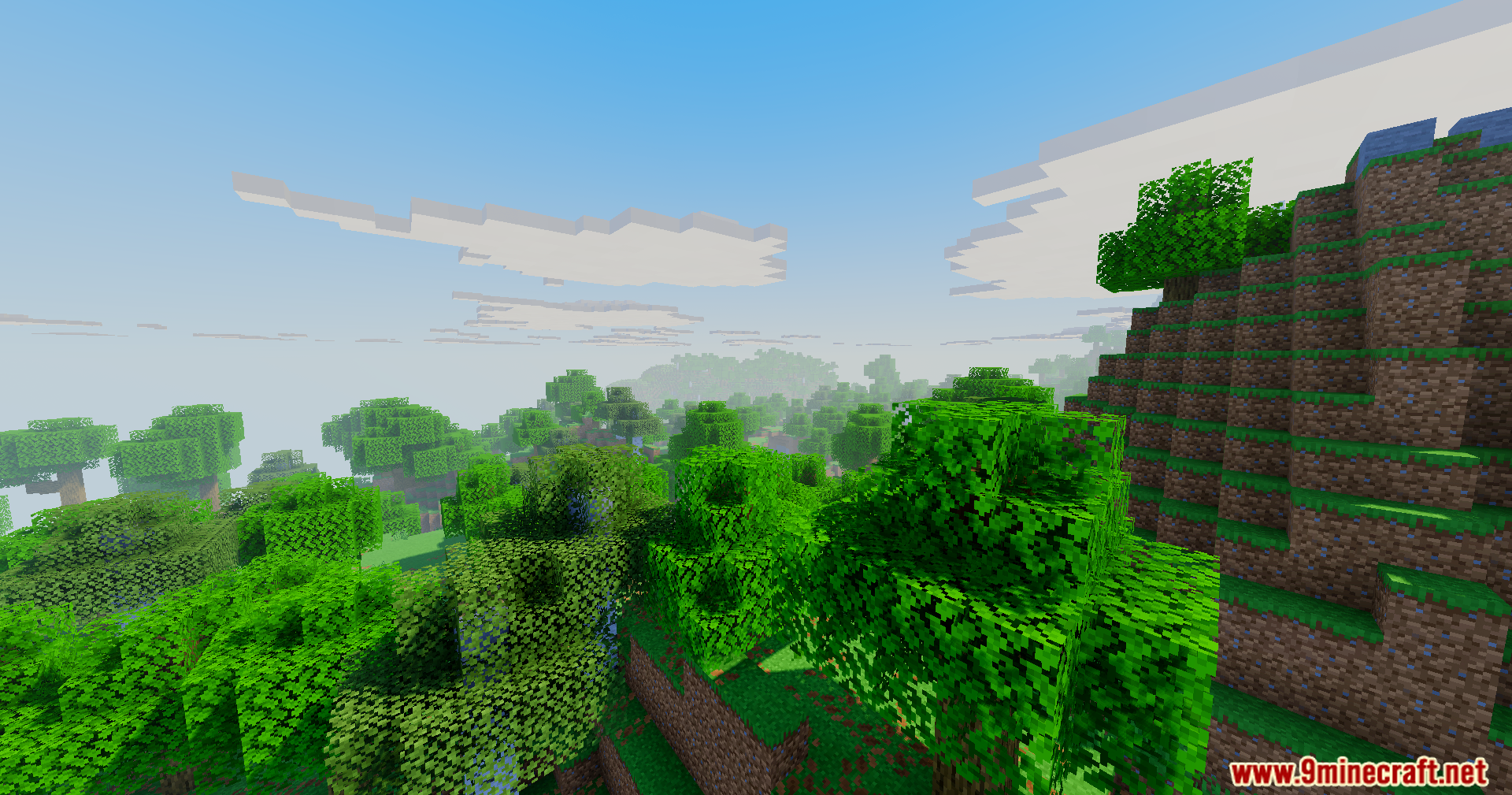 Vibrant green forest landscape with blocky clouds and soft sunlight under a clear sky