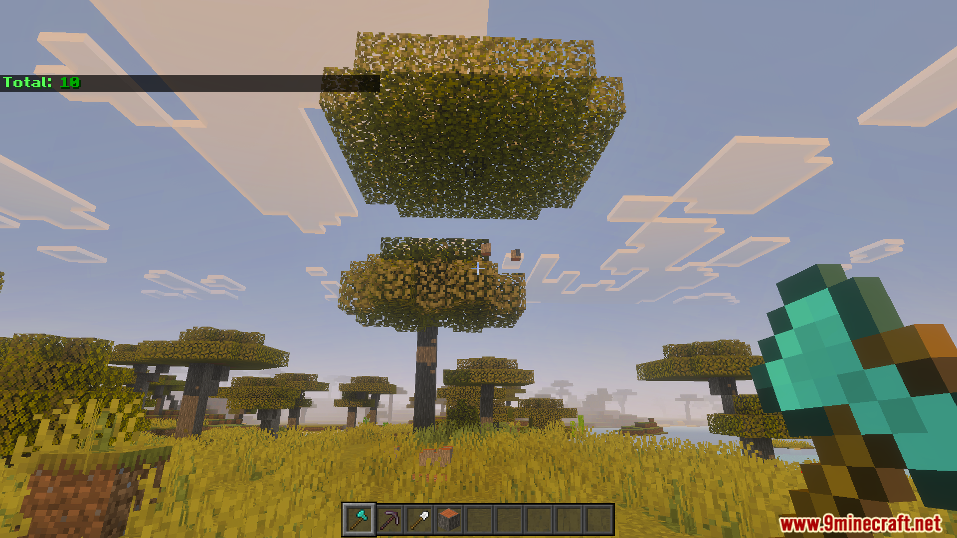 VeinMiner Tree Capitator Addon Screenshot 5 Player using a diamond axe to chop down a whole savanna tree instantly