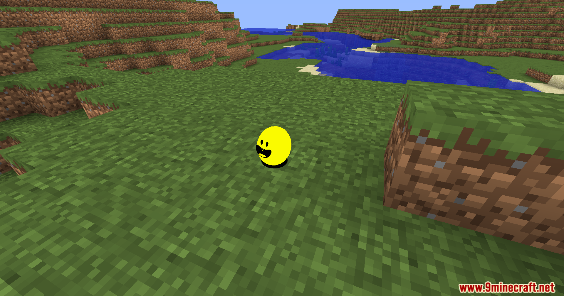 Verity Shaders Screenshot 6 The smooth yellow sphere rests on a grassy field near a blue river