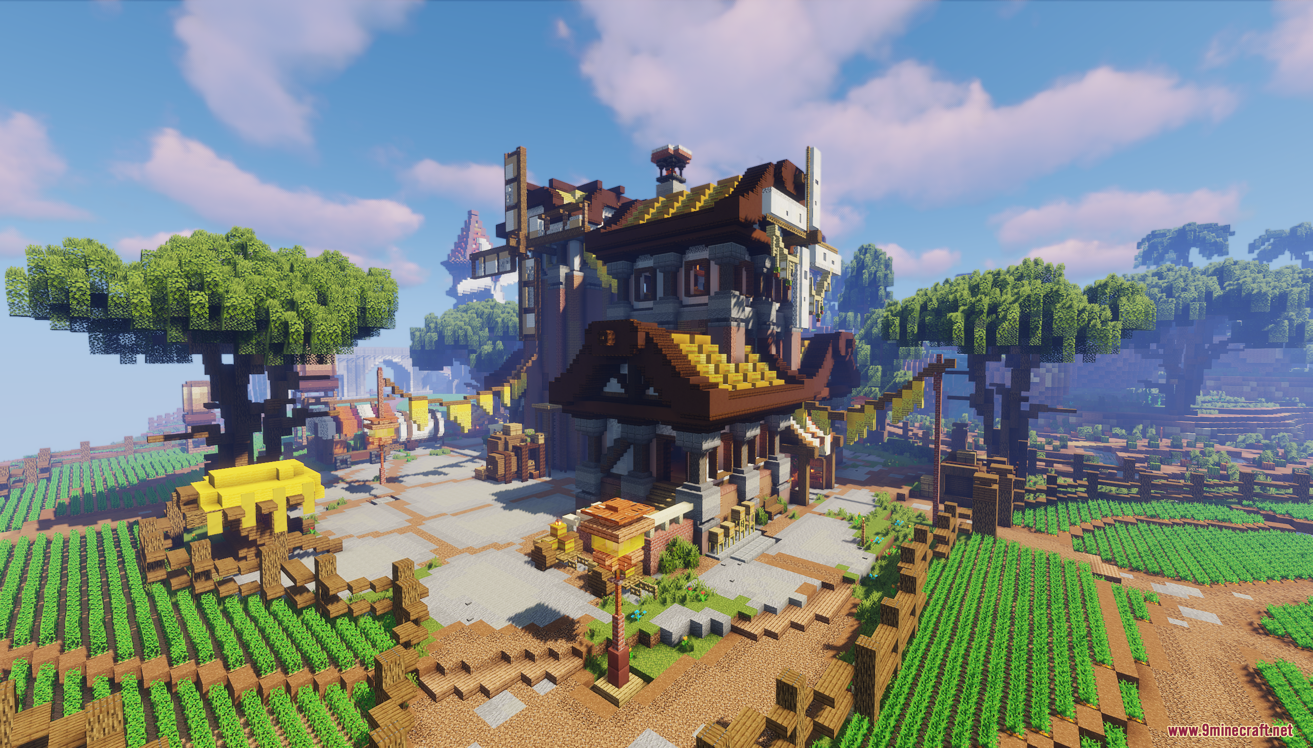 A large rustic farmhouse surrounded by lush green crops and trees