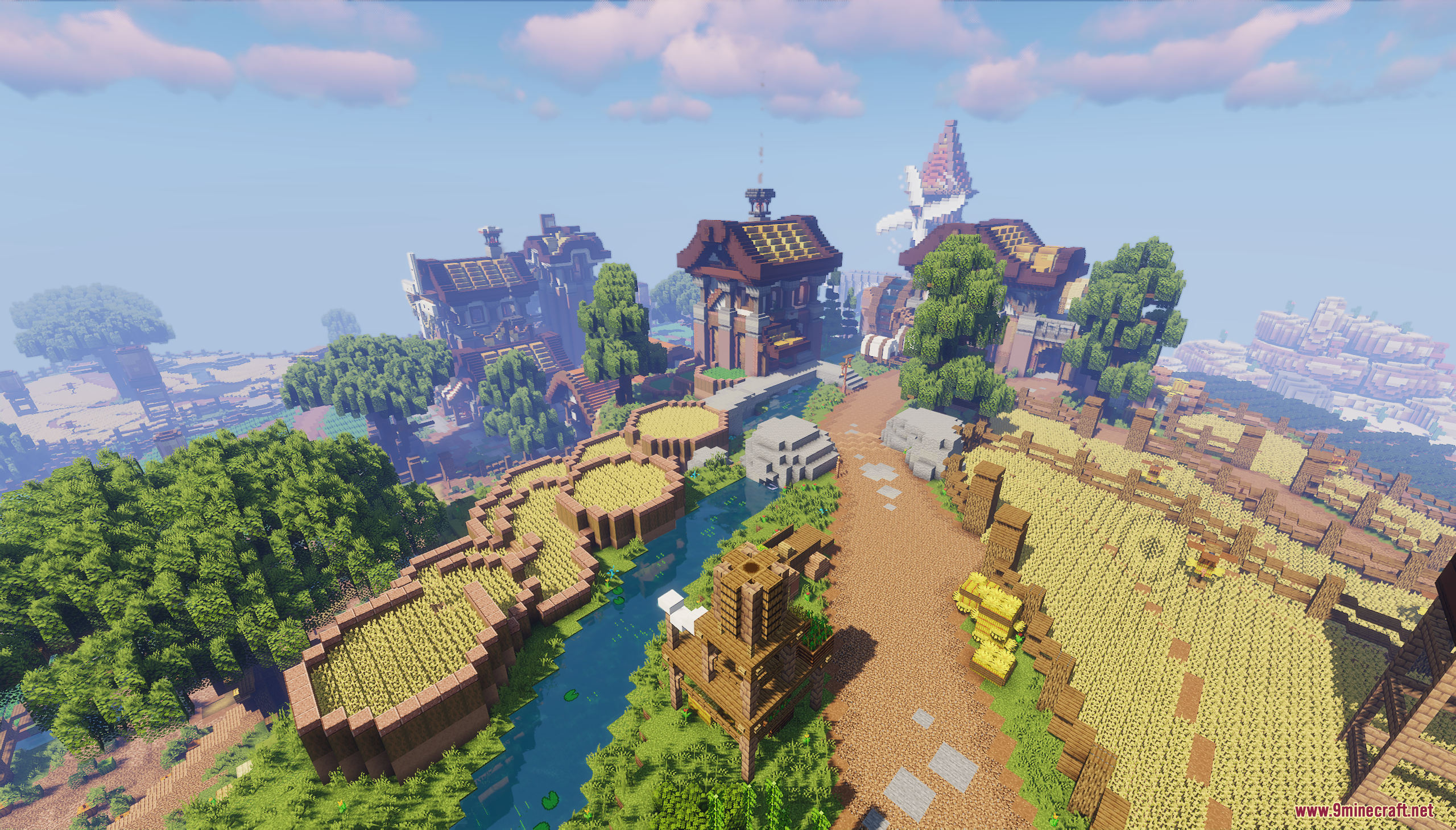 A dirt path winding through lush green trees and golden terraced farm fields