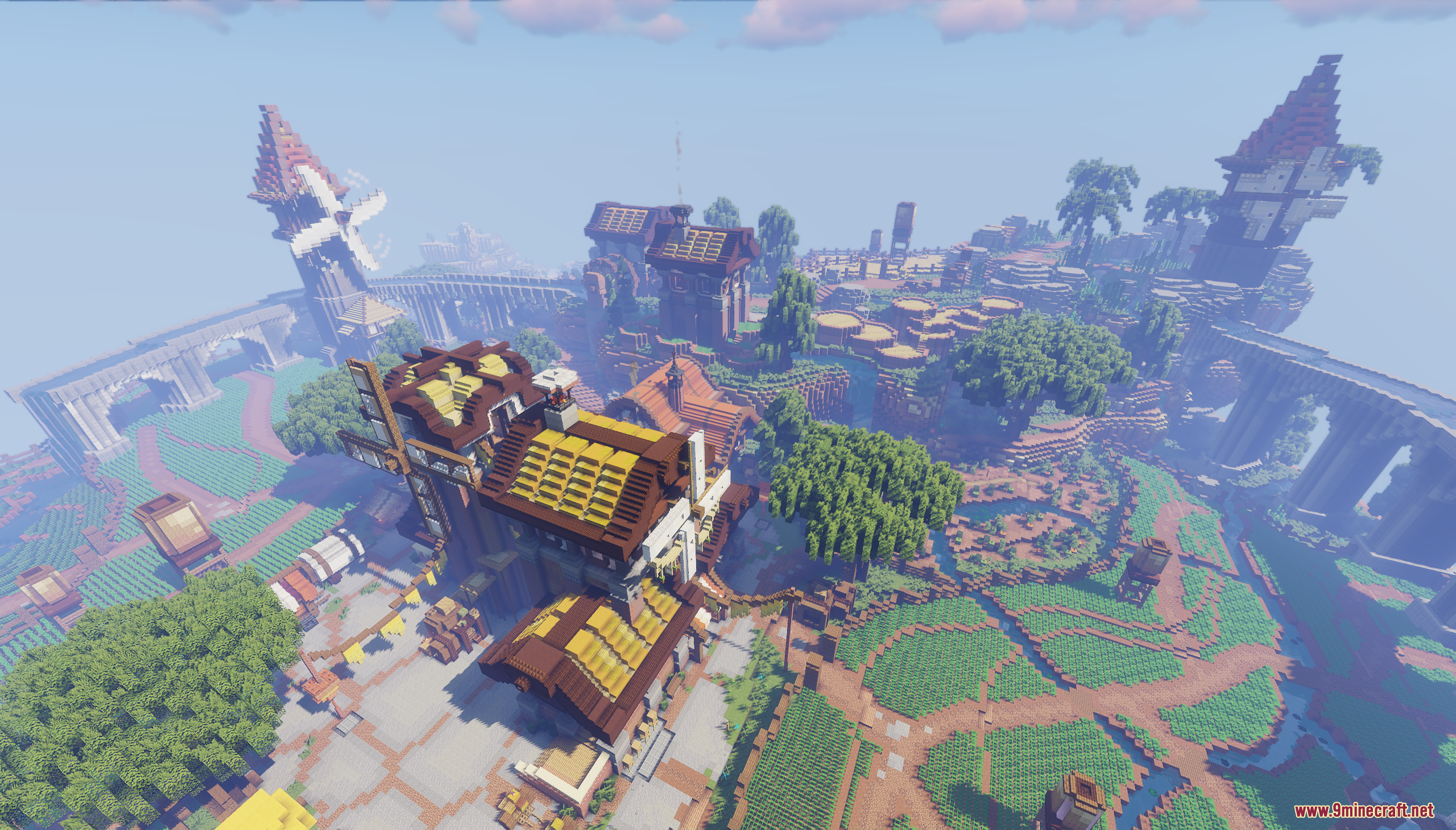 Aerial view of a sprawling Minecraft village with fields and windmills