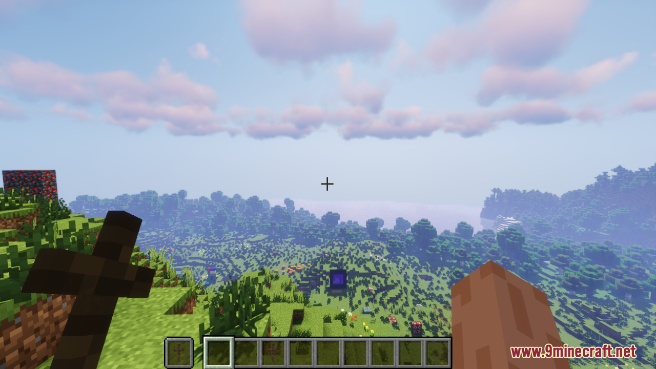 Wood Totem Cross Resource Pack Screenshot 1 A player holding a wooden cross totem while looking over a vast landscape