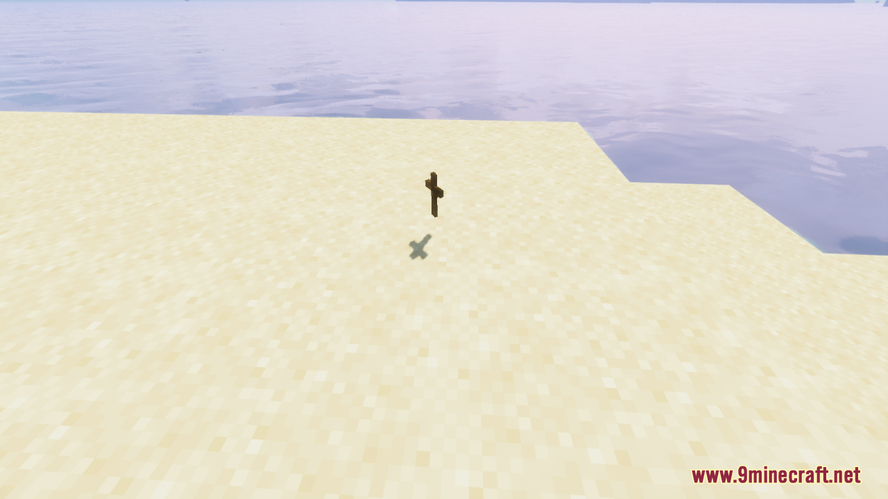 Wood Totem Cross Resource Pack Screenshot 4 A wooden cross item sits on the sand of a Minecraft beach