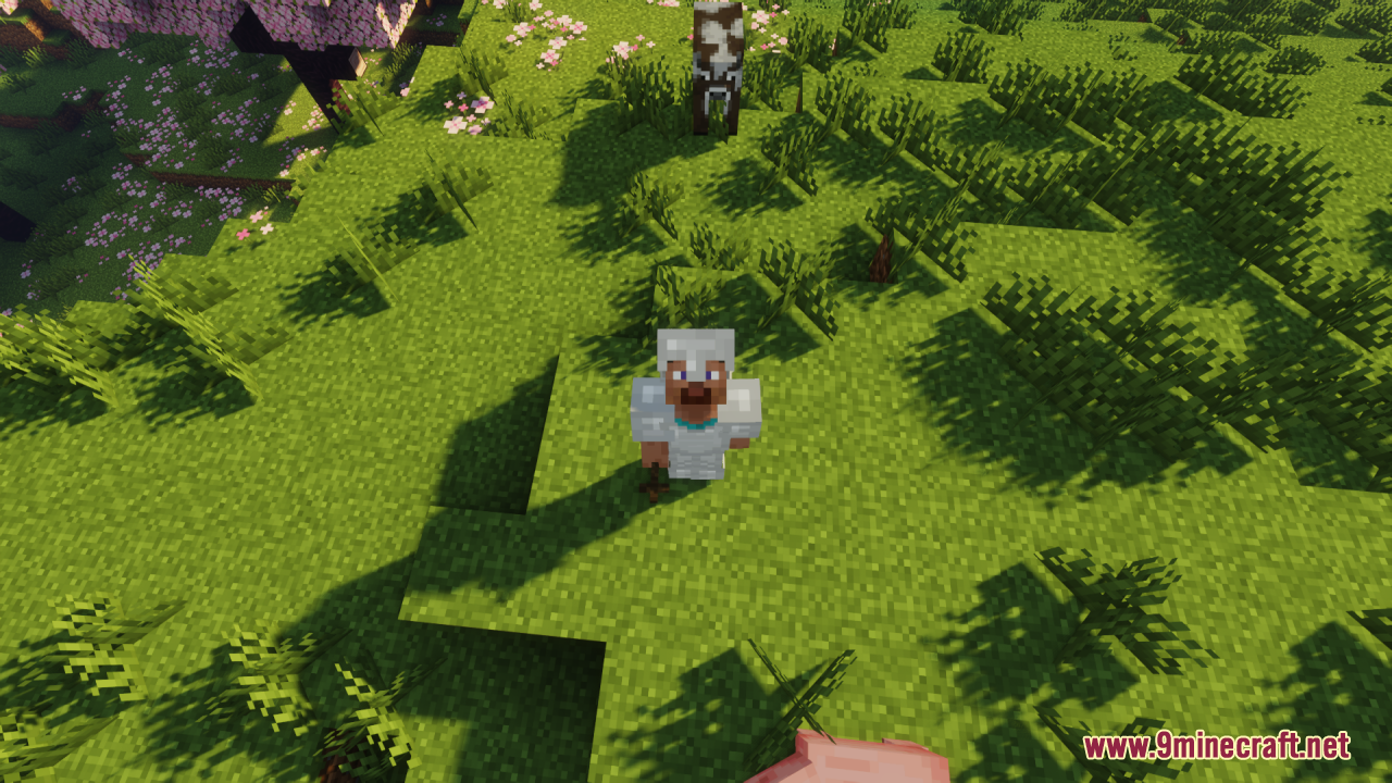Wood Totem Cross Resource Pack Screenshot 7 A player wearing iron armor holds a wooden cross totem in a field