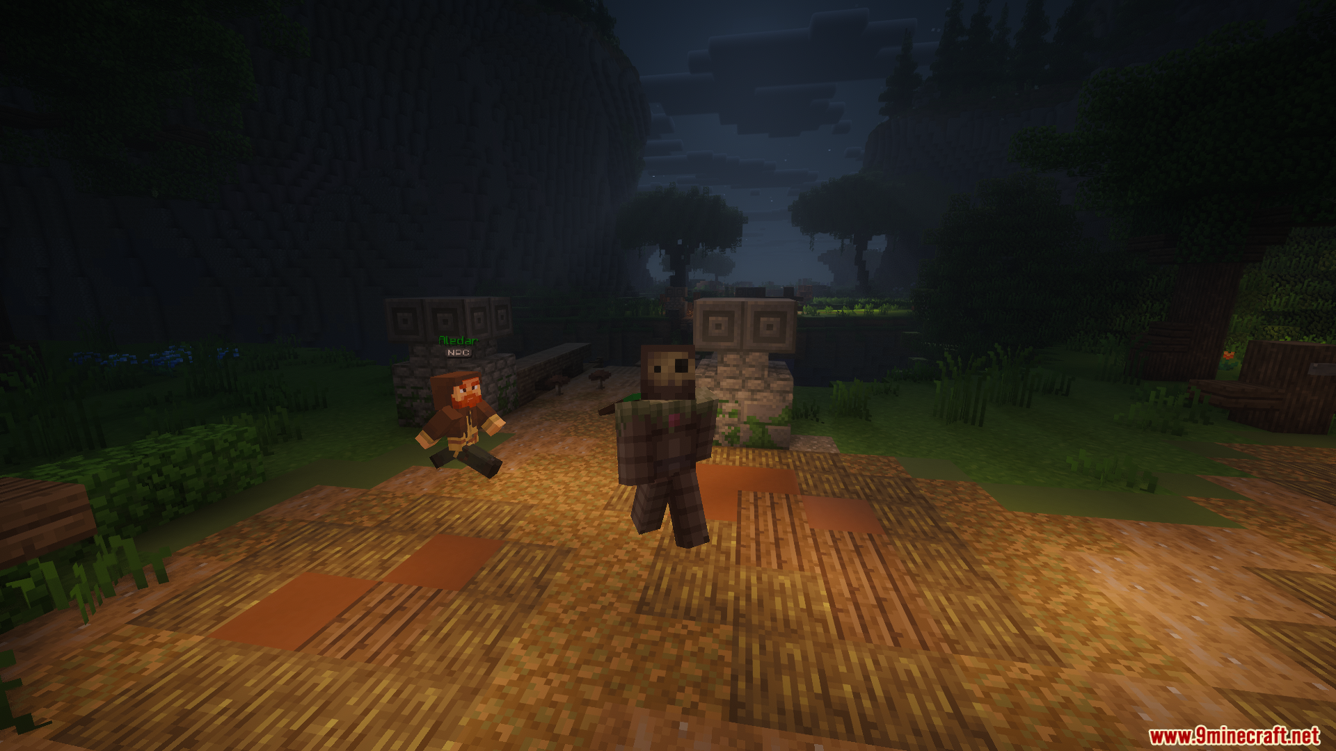 Two players walking on a dirt path between stone pillars at night