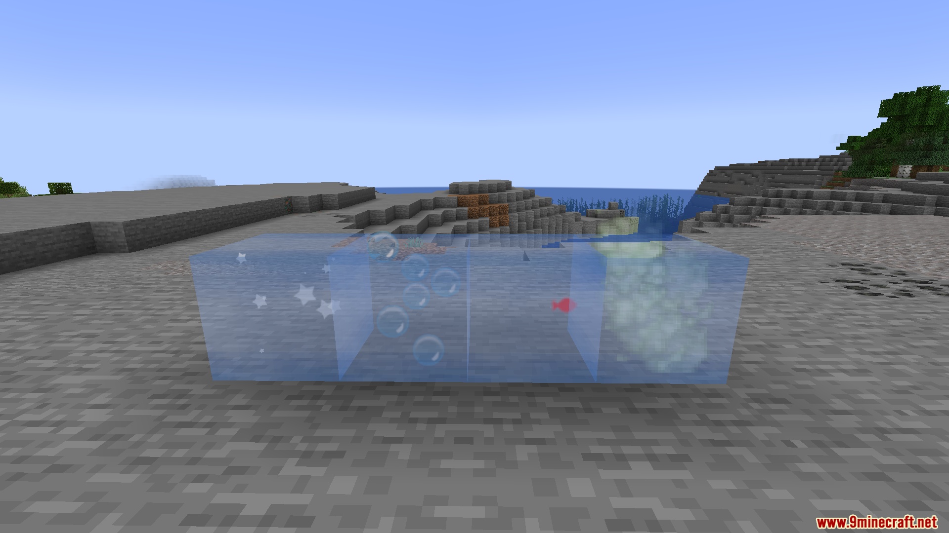 Four glass blocks showing various moving particle effects on sandy terrain