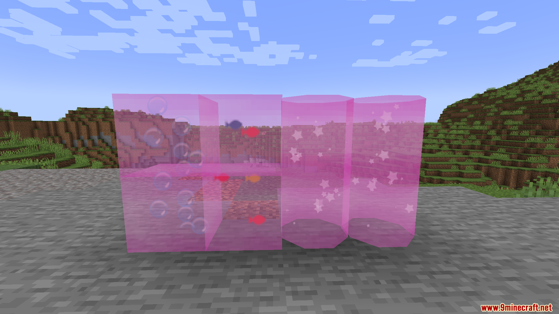 Pink glass blocks and cylinders containing bubbles fish and star particles