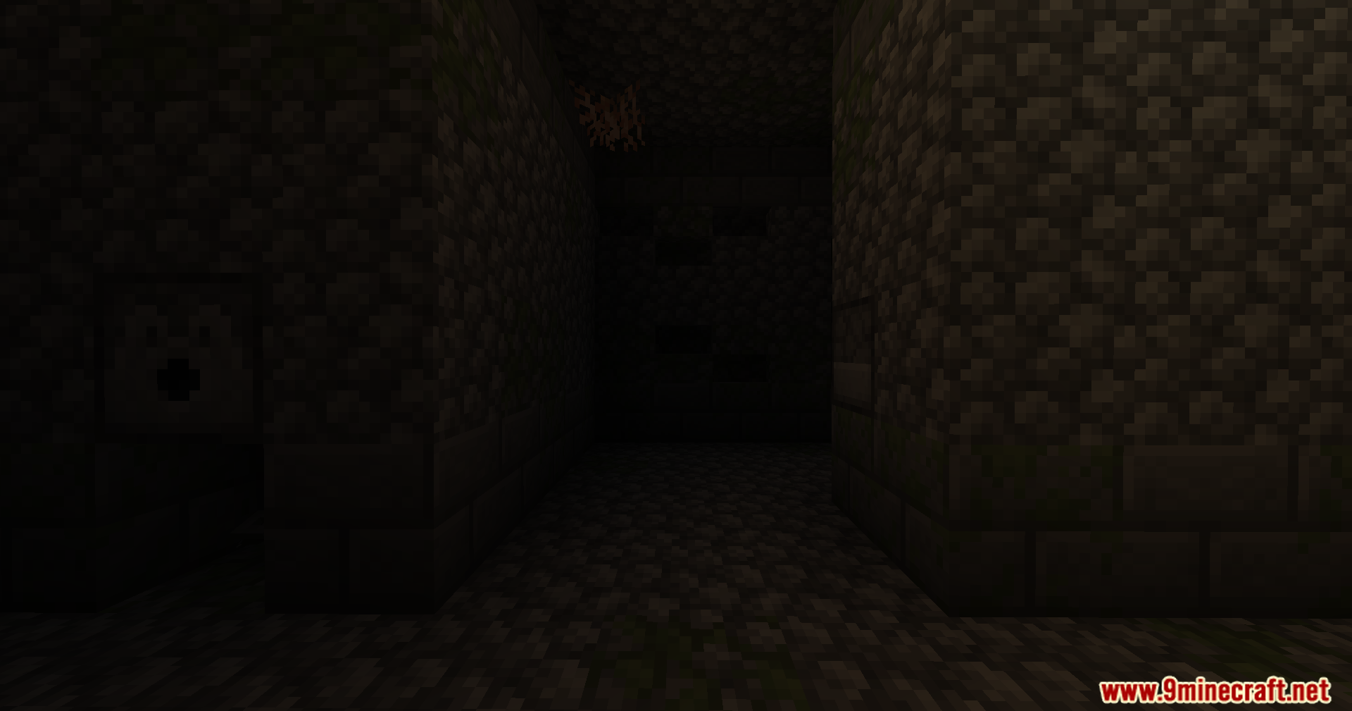 YUNG's Better Jungle Temples Mod Screenshot 12 A dark corridor inside a jungle temple with a dispenser trap on the wall