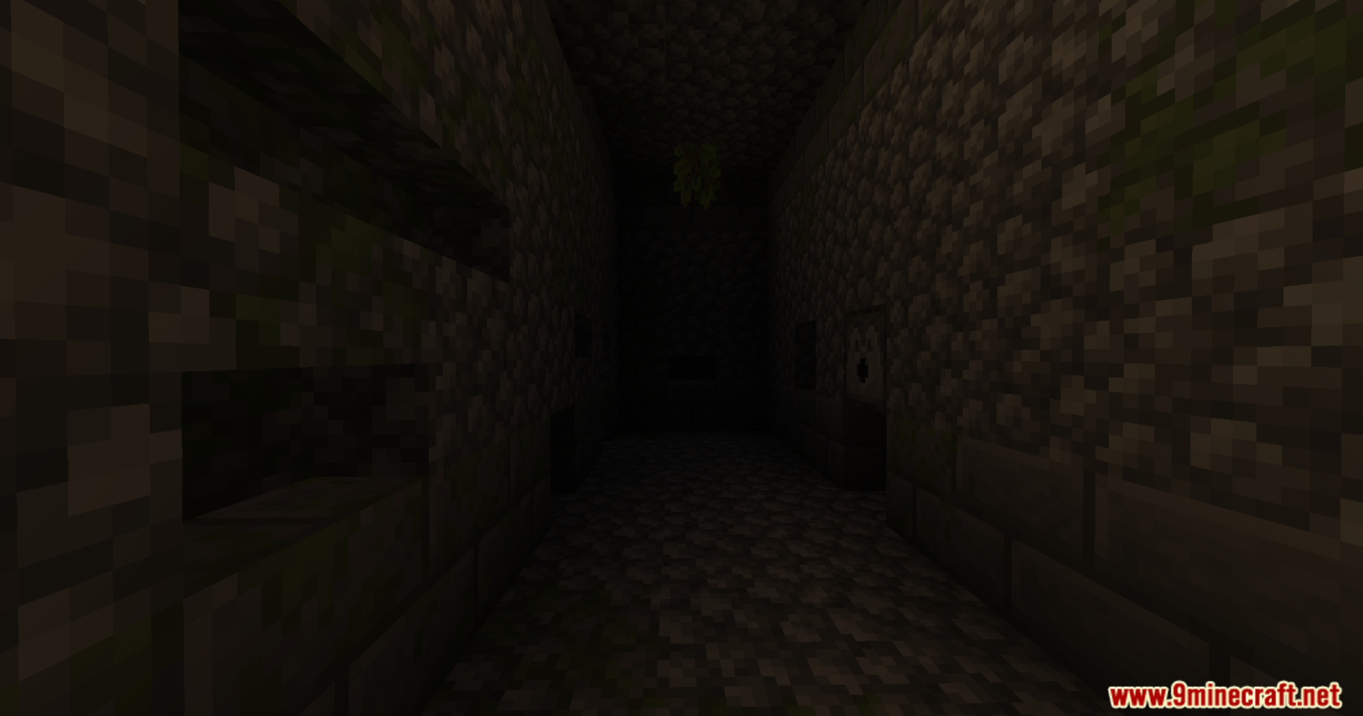 YUNG's Better Jungle Temples Mod Screenshot 6 Narrow dark corridor with cobblestone walls inside a mysterious jungle temple