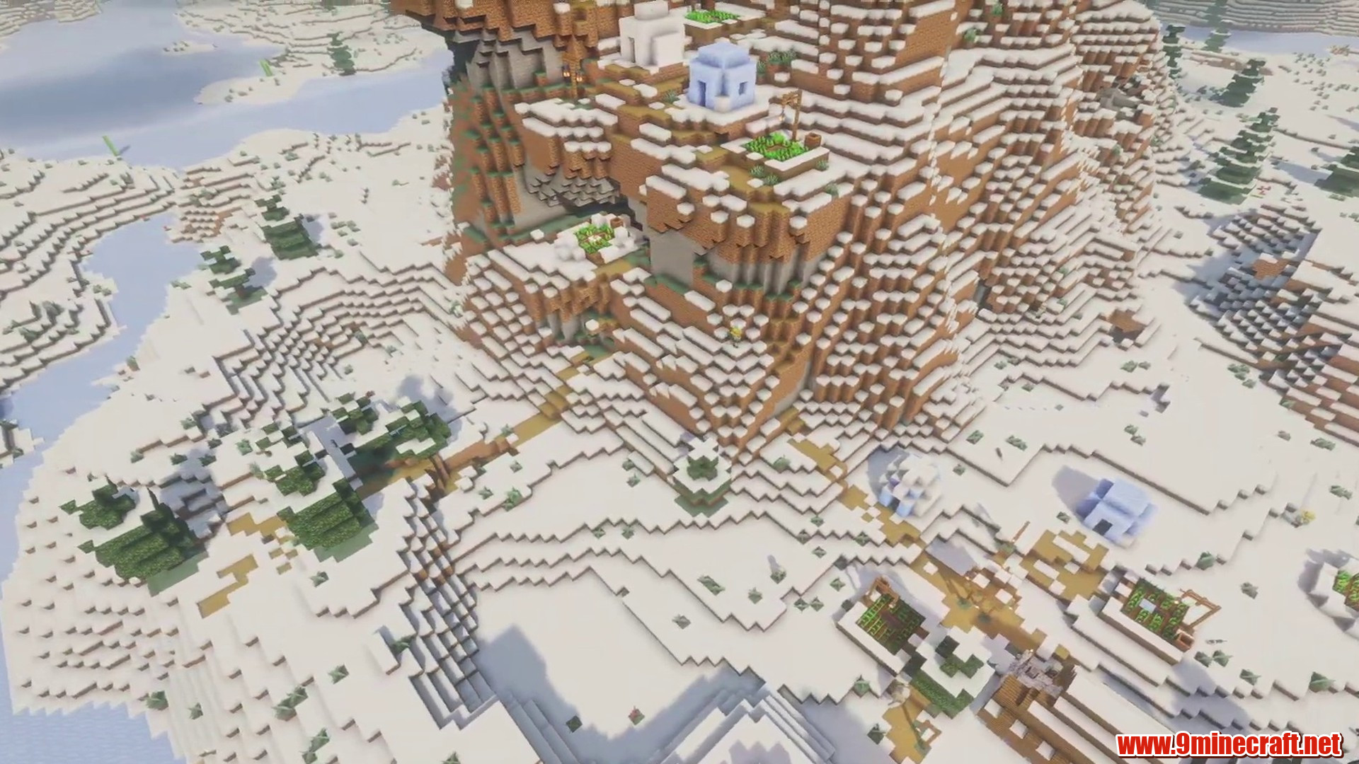Open winter terrain around a mountain village