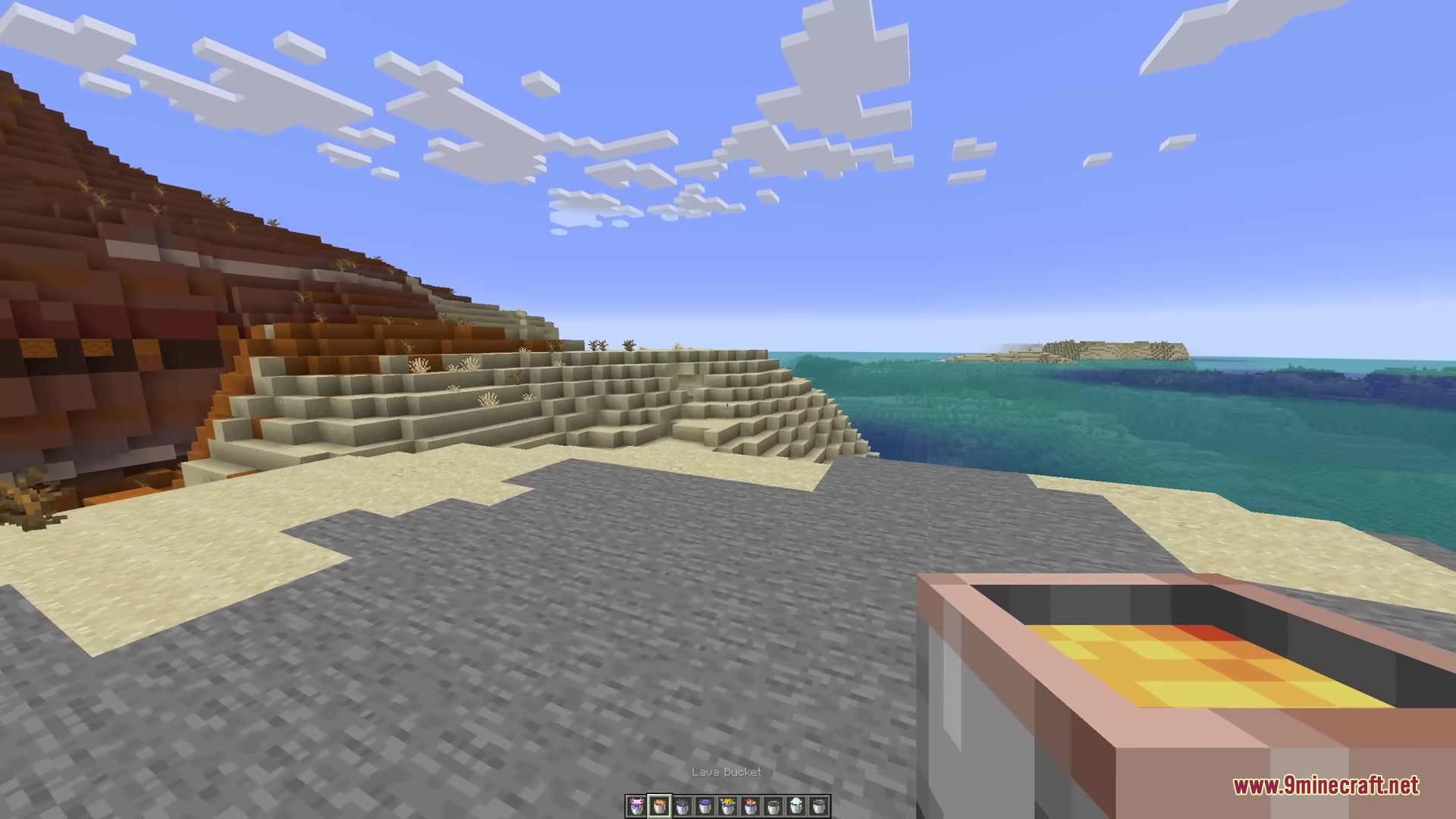 3 D Buckets Resource Pack Screenshot 1 Player holding a 3D lava bucket in a mesa biome near the ocean